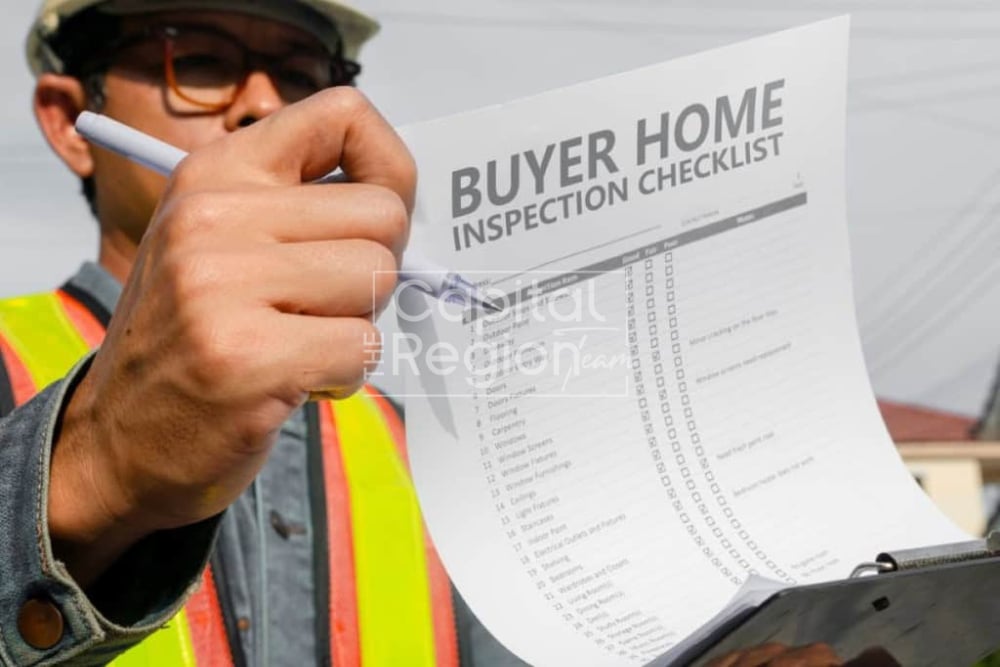 Home inspector checks items on a buyer home inspection checklist.