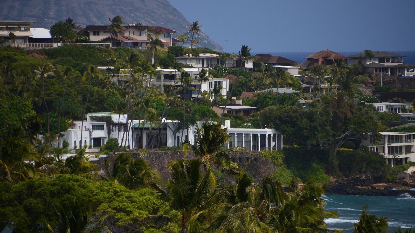 Hillside and oceanfront homes along the East Honolulu coastline seen from Diamond Head