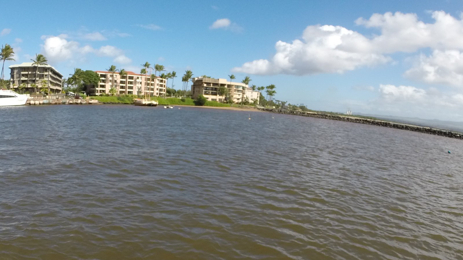 Low-rise condominium buildings along the shoreline at Maalaea Harbor, Maui