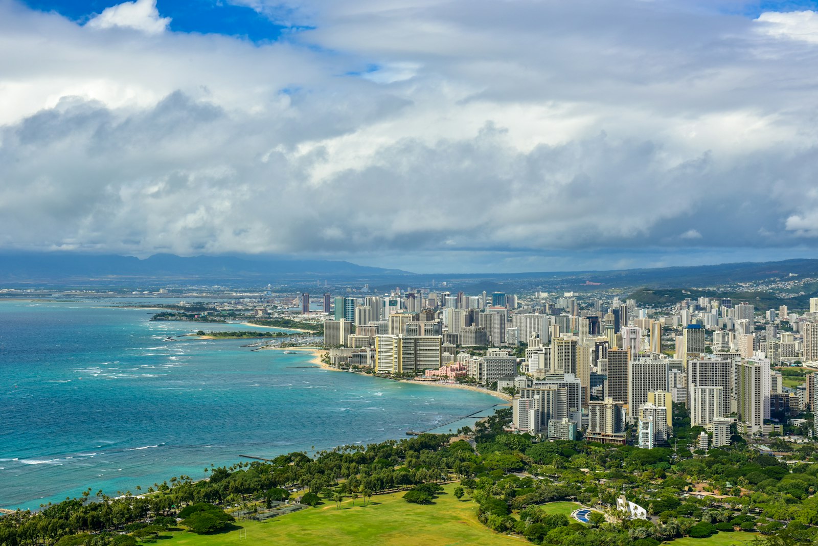 Aerial view of homes and buildings below Diamond Head in Honolulu