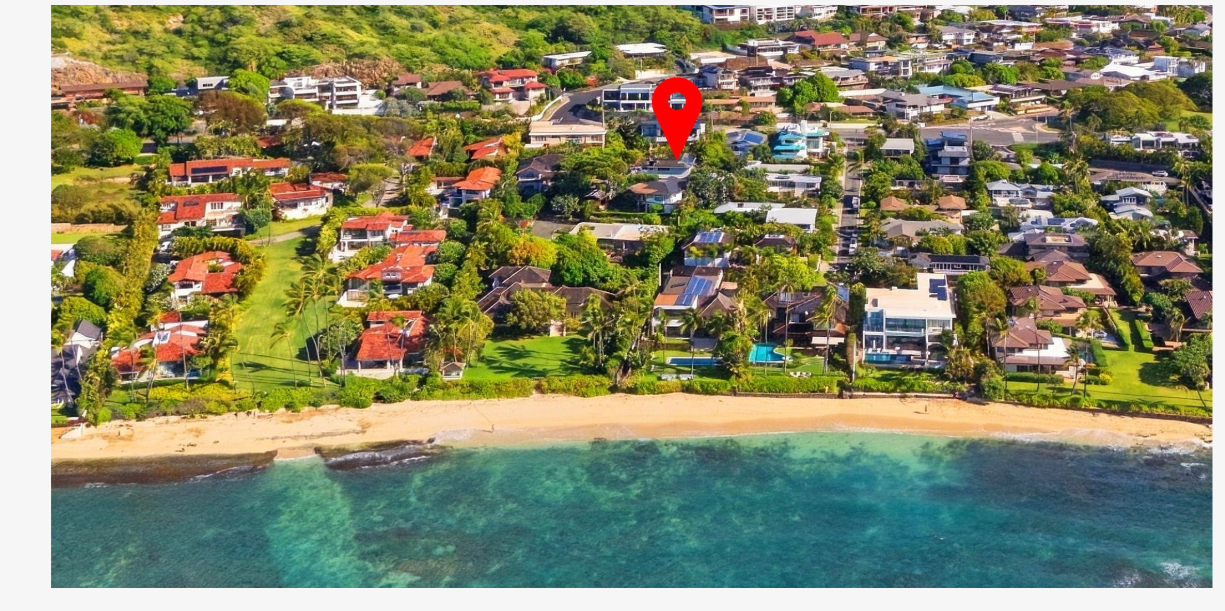 A closer aerial look at the sandy beach and reef fronting the neighborhood at Cromwell's Cove