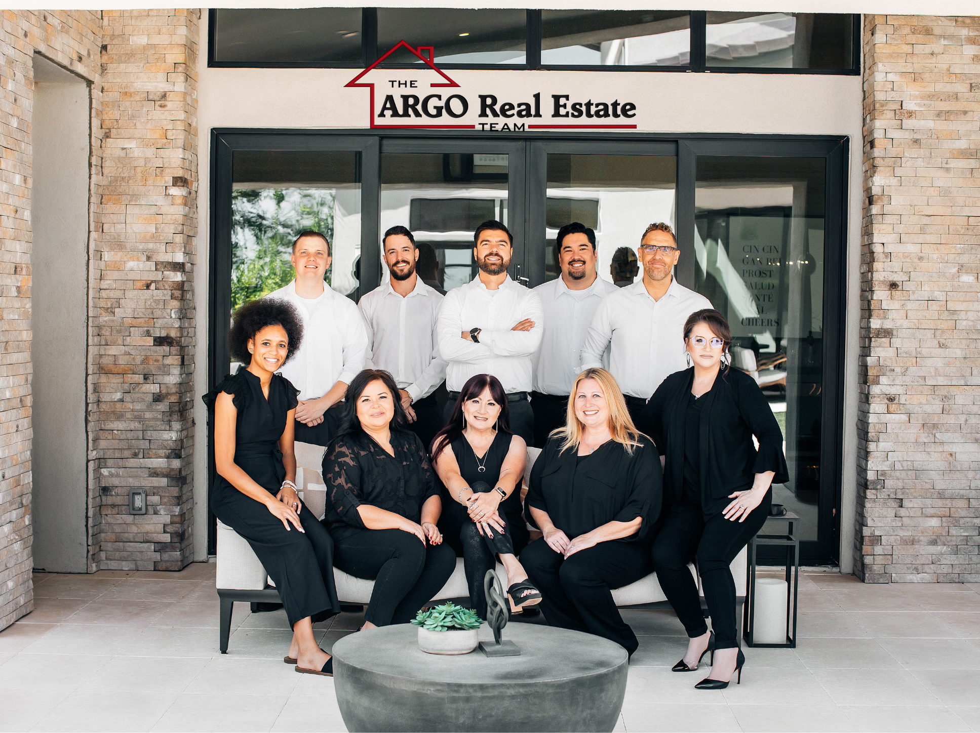 The ARGO Real Estate Team in front of their office