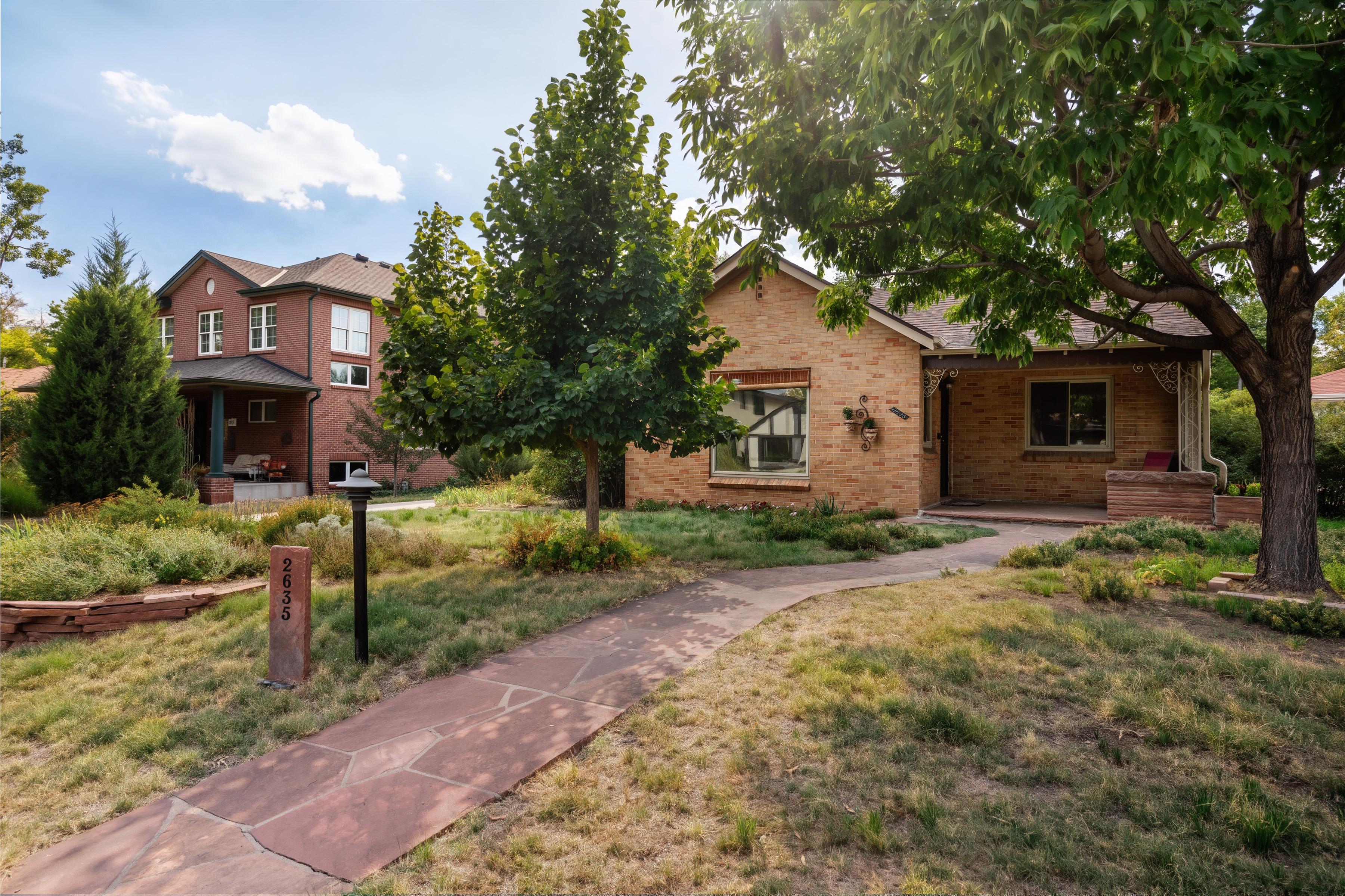 Front walkway and shaded entry at 2635 Wolff Street in Denver