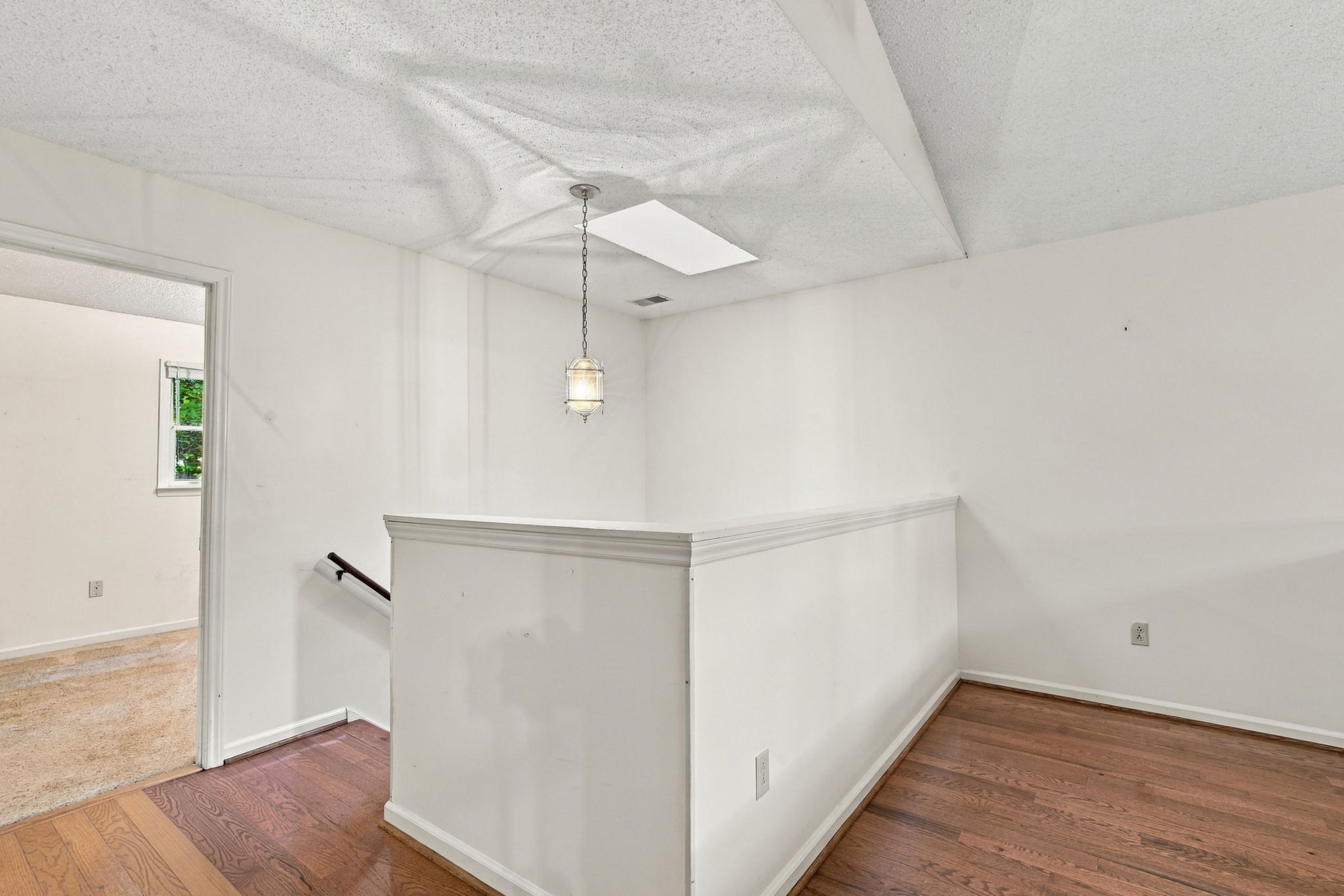 Actual upper-level loft landing next to the stairwell