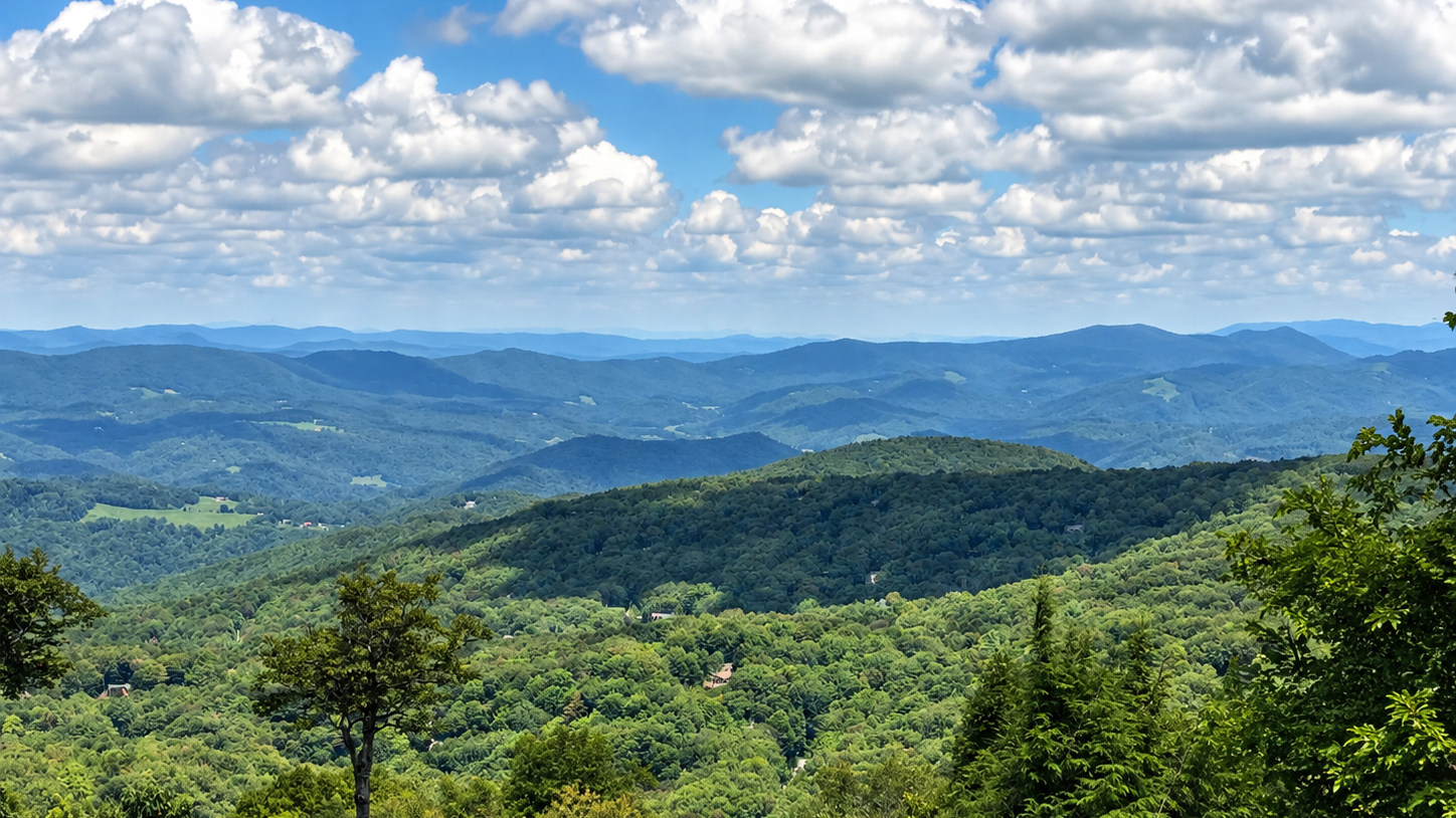 Layered summer mountain ridges and broad Blue Ridge views photographed from Beech Mountain, North Carolina