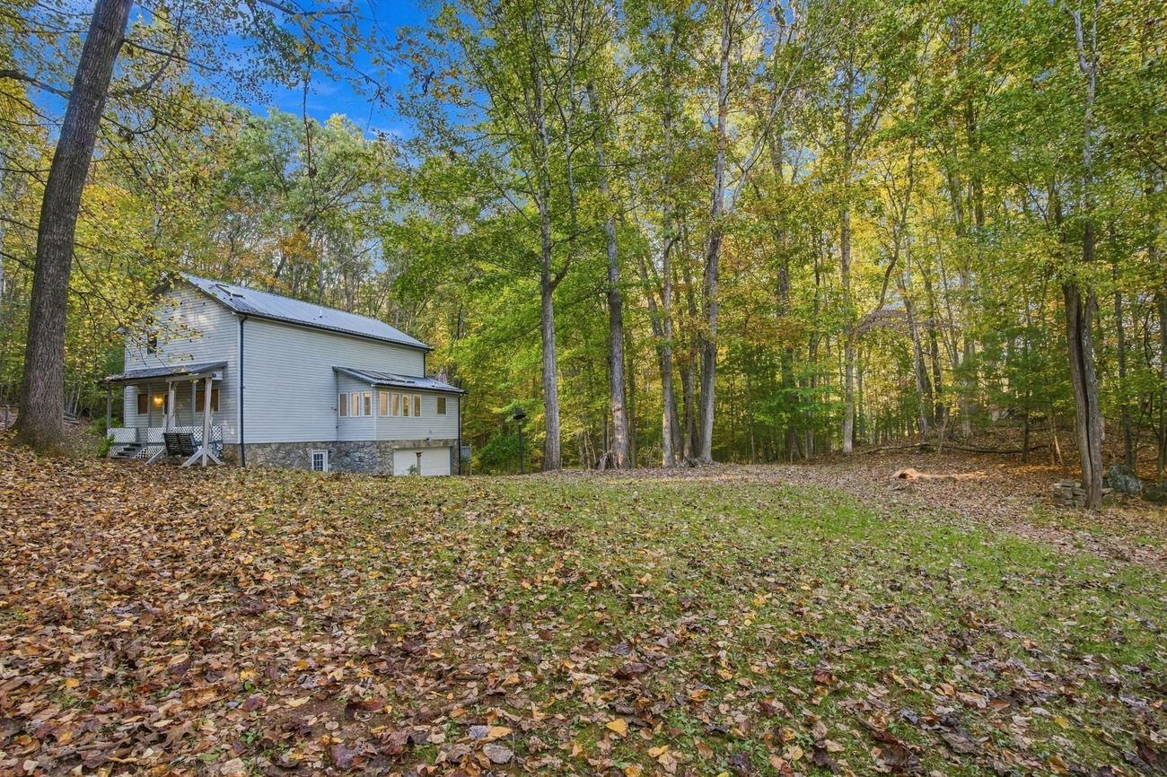 Actual exterior photo of 271 Quail Hollow Road in a wooded mountain setting