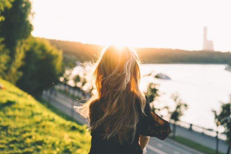 A woman is enjoying the landscape.