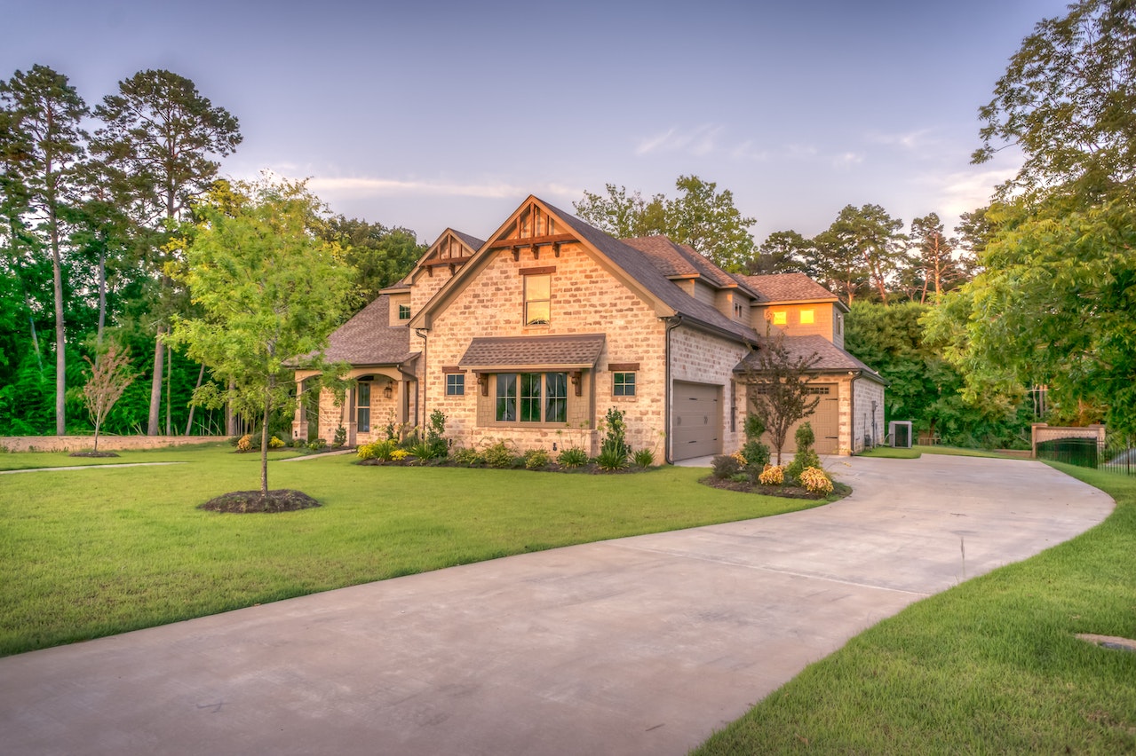 beige bungalow house near trees