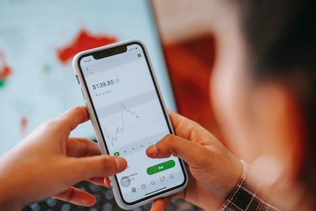 man looking at price graphic on the phone