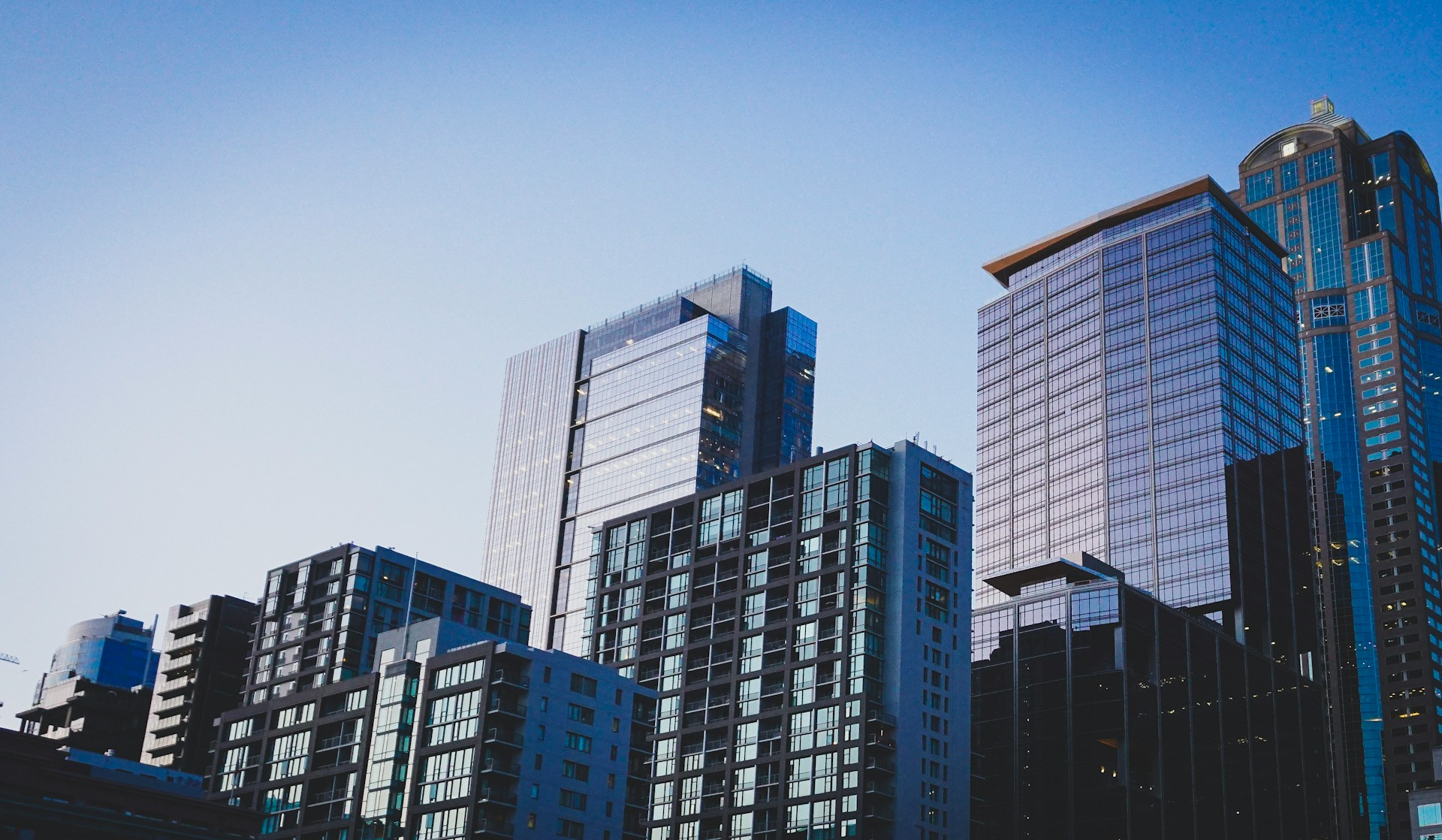 High-rise buildings against a blue sky