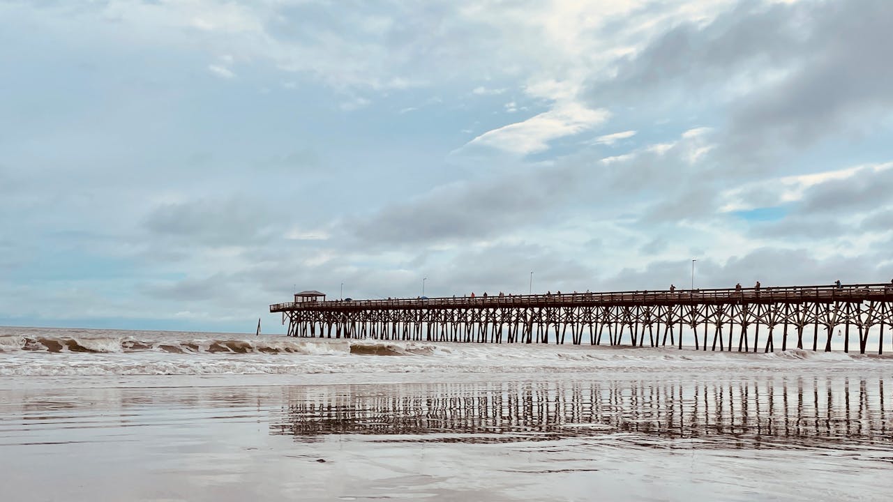 A wooden pier on the beach.