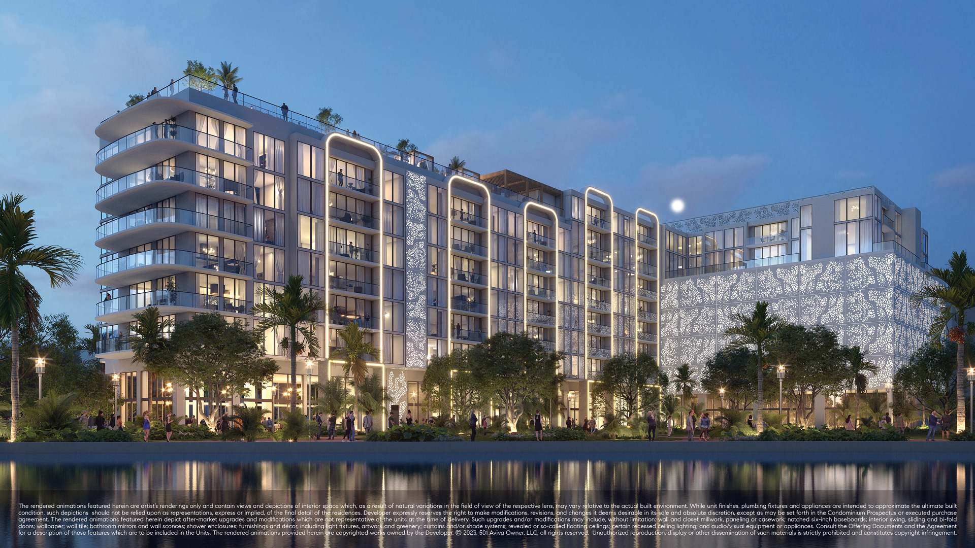 Sixth & Rio building exterior at dusk with rooftop deck and riverfront landscaping