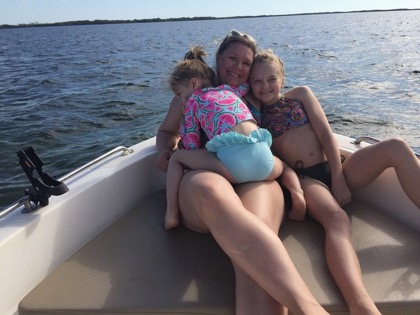 Skye Maze with her daughters on the water