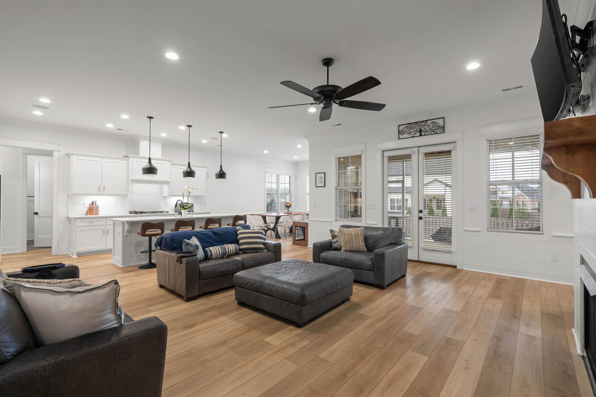 Expansive 1-level open floor plan featuring 10' ceilings and a beautiful floor-to-ceiling shiplap fireplace.