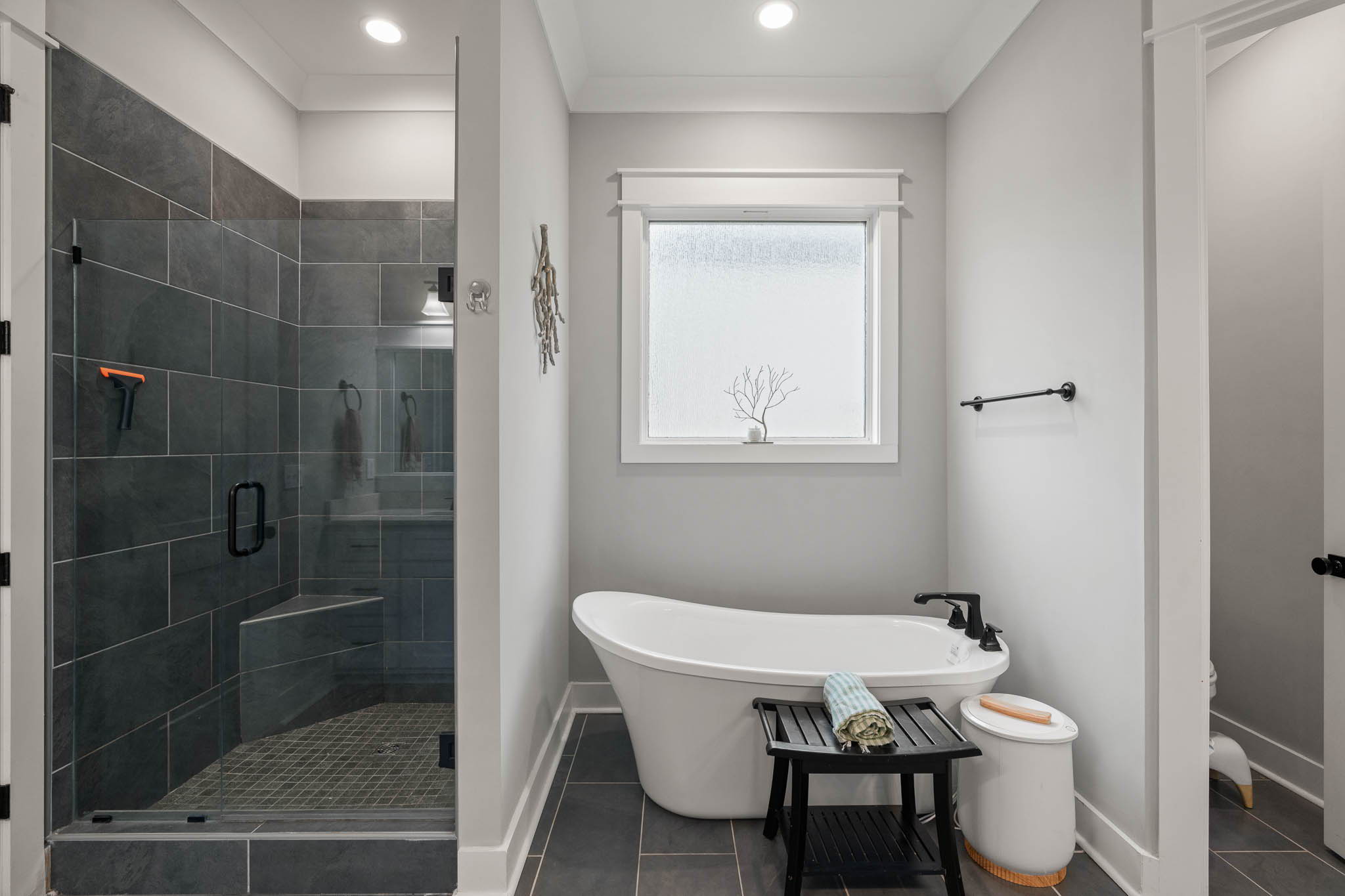 The spa-like Master Bath features a free-standing tub, separate tile shower, and solid closet shelving.