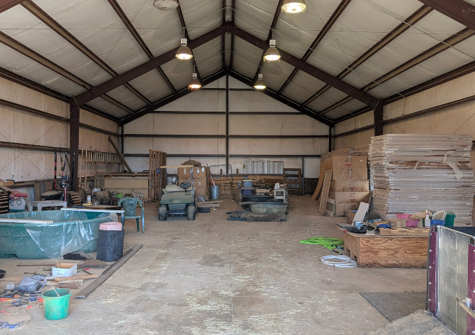Interior view of the massive workshop with power and water, ideal for hobbies or equestrian use.