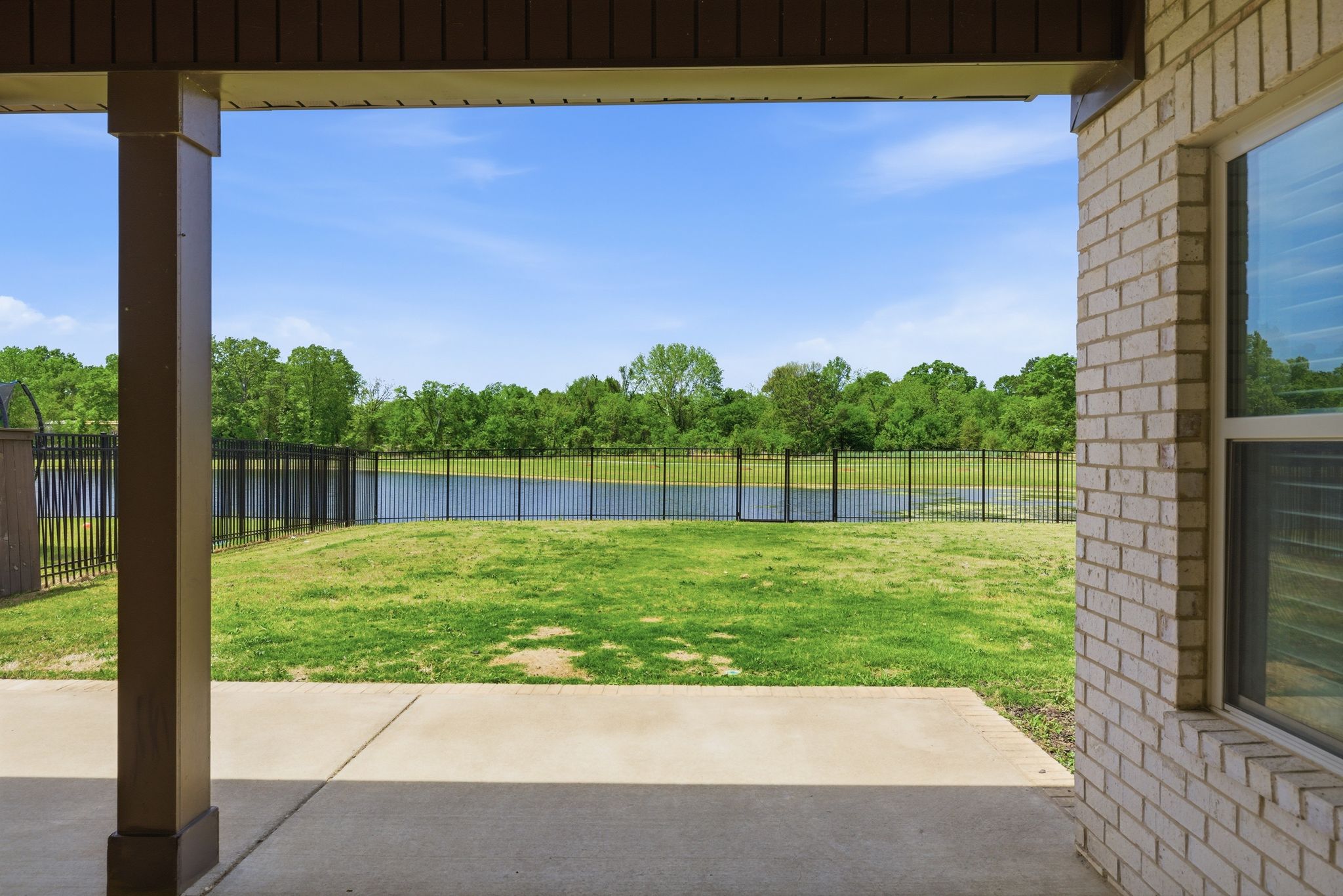 Enjoy the outdoors with a covered patio backing to the lake.