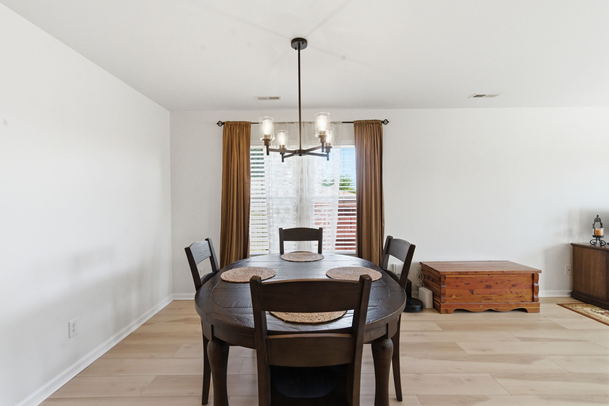 The kitchen features an island, dual pantries, and new appliances.