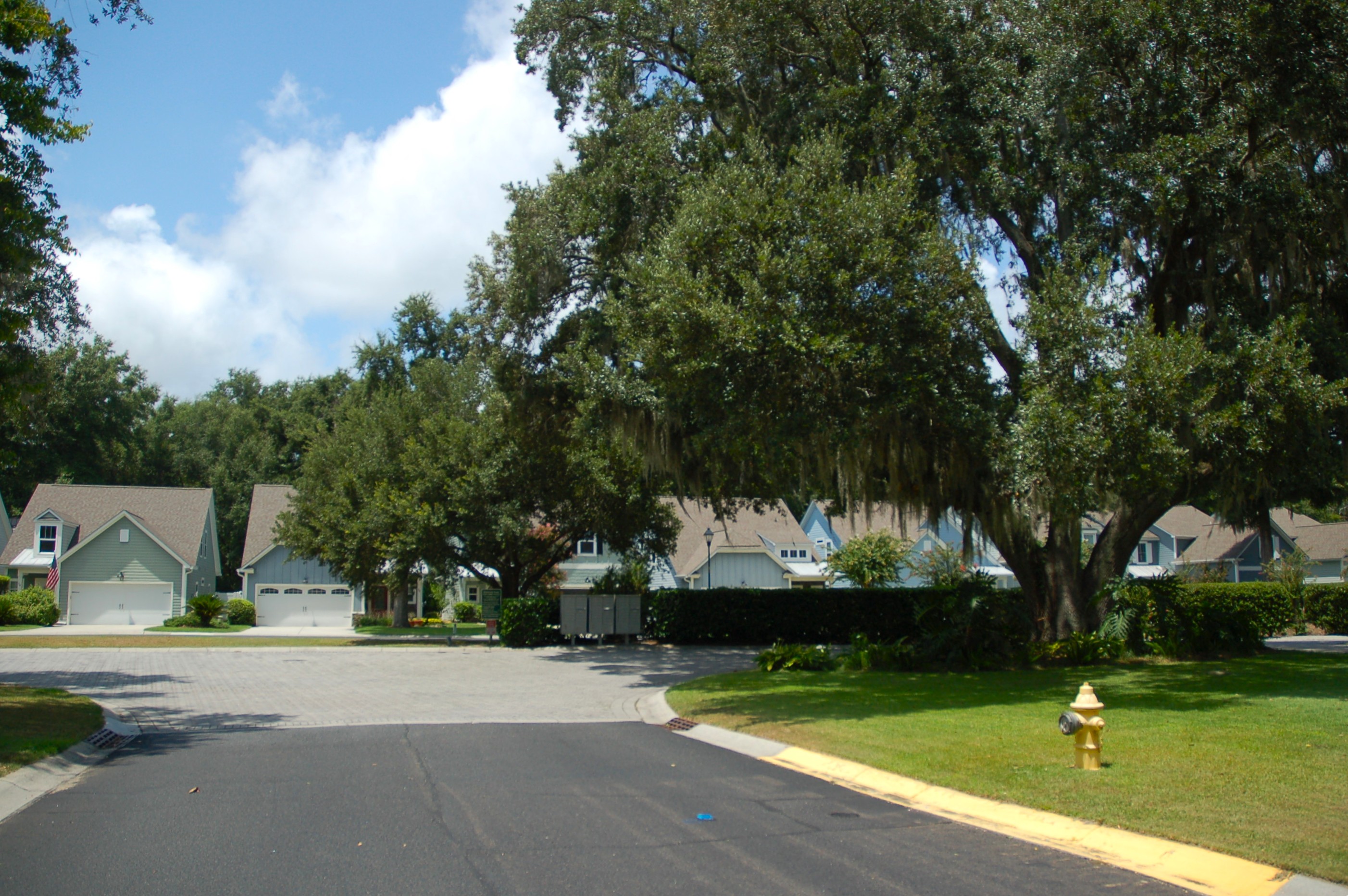 Community mailbox cluster shaded by mature live oaks at the entrance of Beach City Place, a gated neighborhood in historic Mitchelville on Hilton Head Island, SC