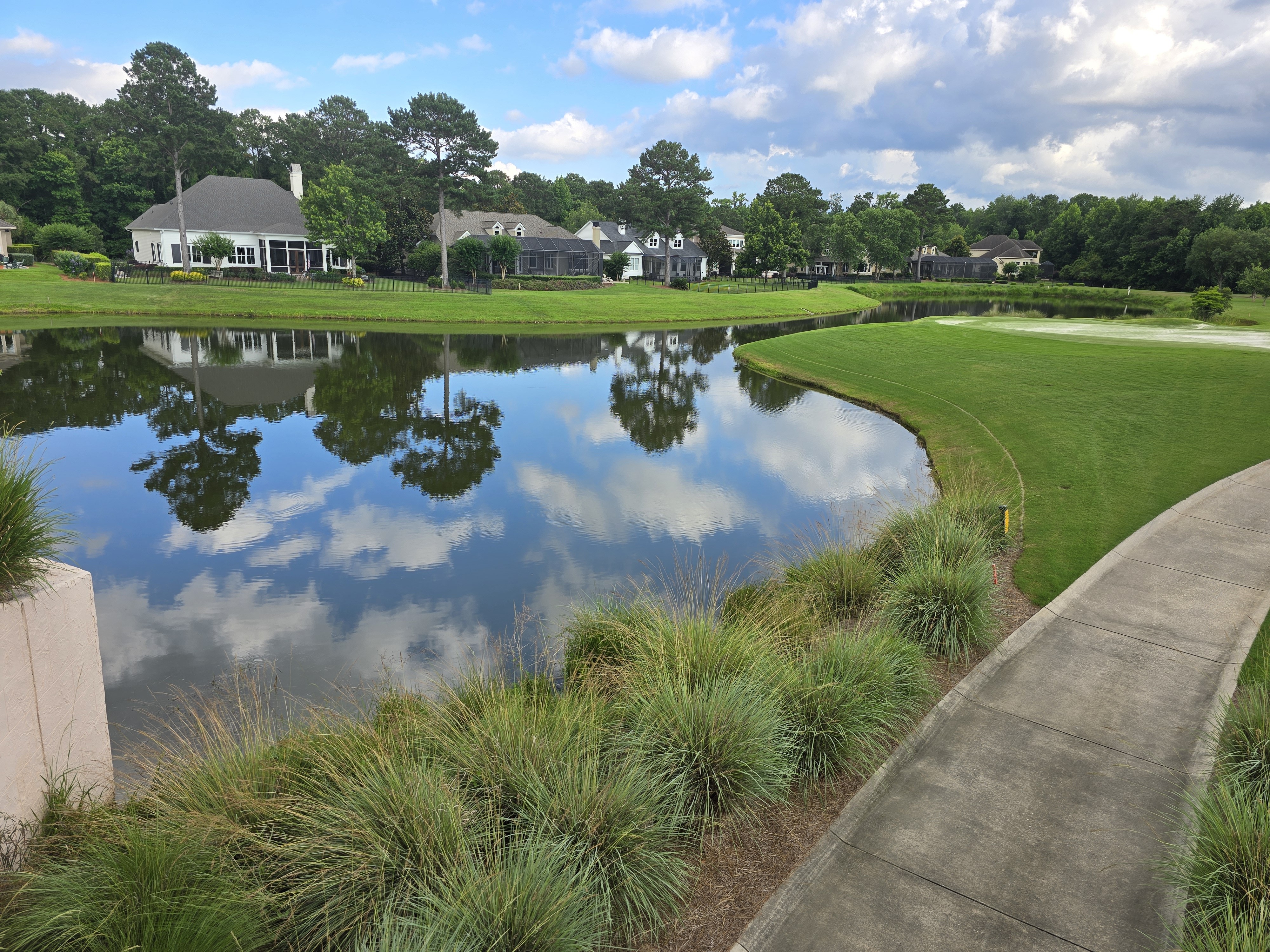 Hampton Hall golf cart path beside lagoon in Bluffton SC