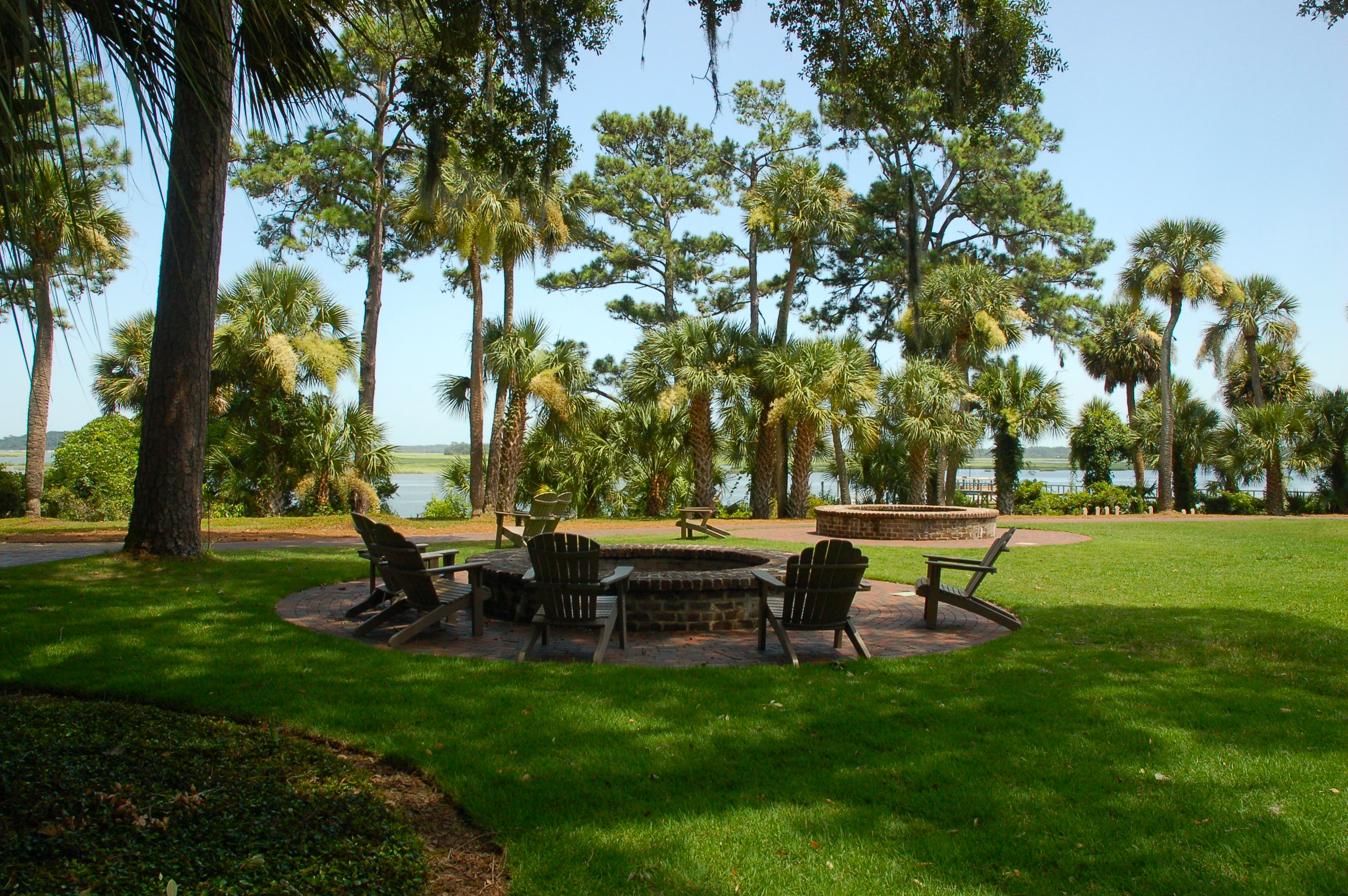 Evening firepit gathering with May River views at Palmetto Bluff, Bluffton SC