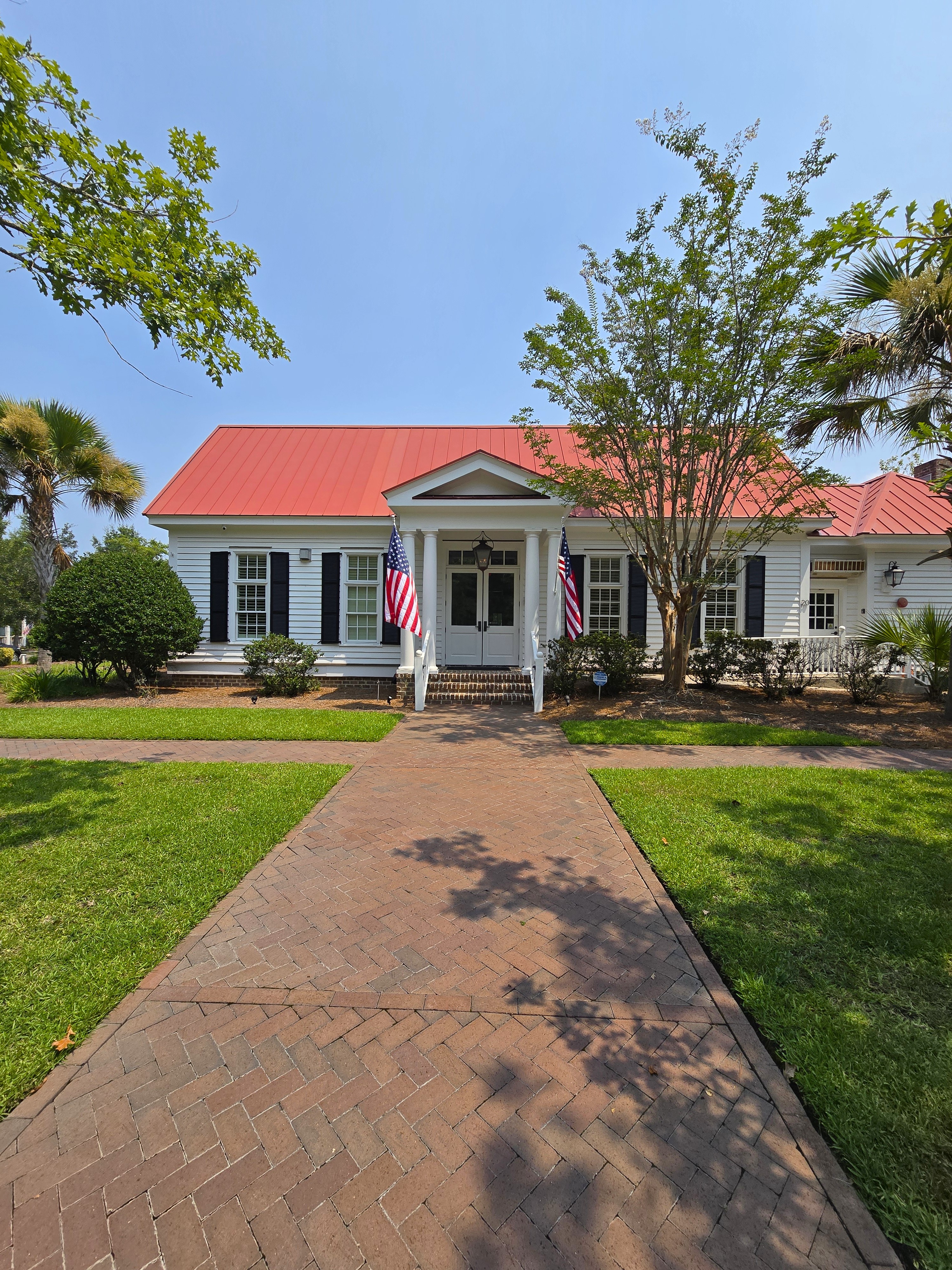 Front view of The Club at Shell Hall clubhouse with a gas lamp in Bluffton SC