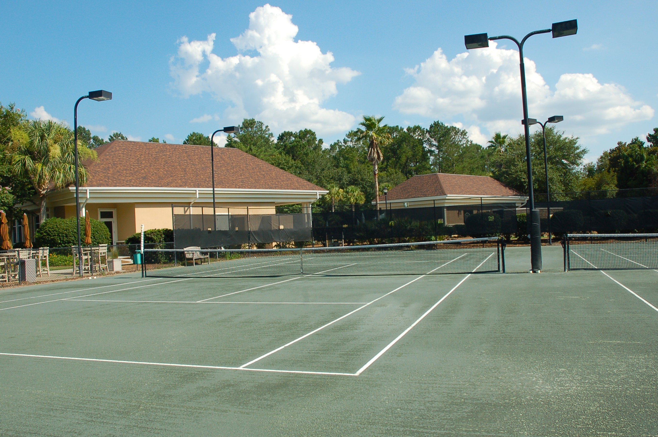 Lit tennis courts at The Haven at New Riverside