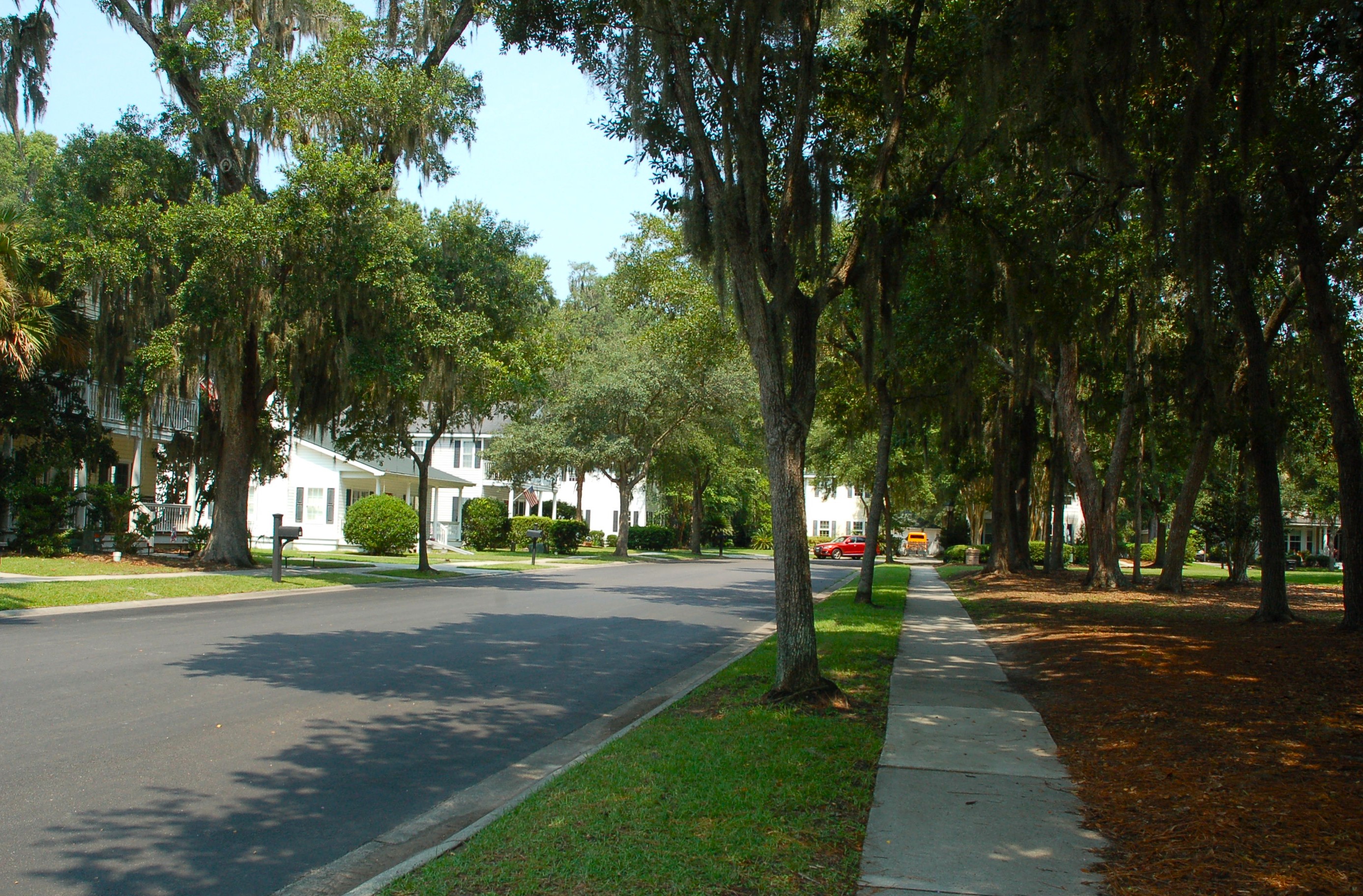 Typical single-family homes in Westbury Park with large porches and Charleston design elements in Bluffton, SC