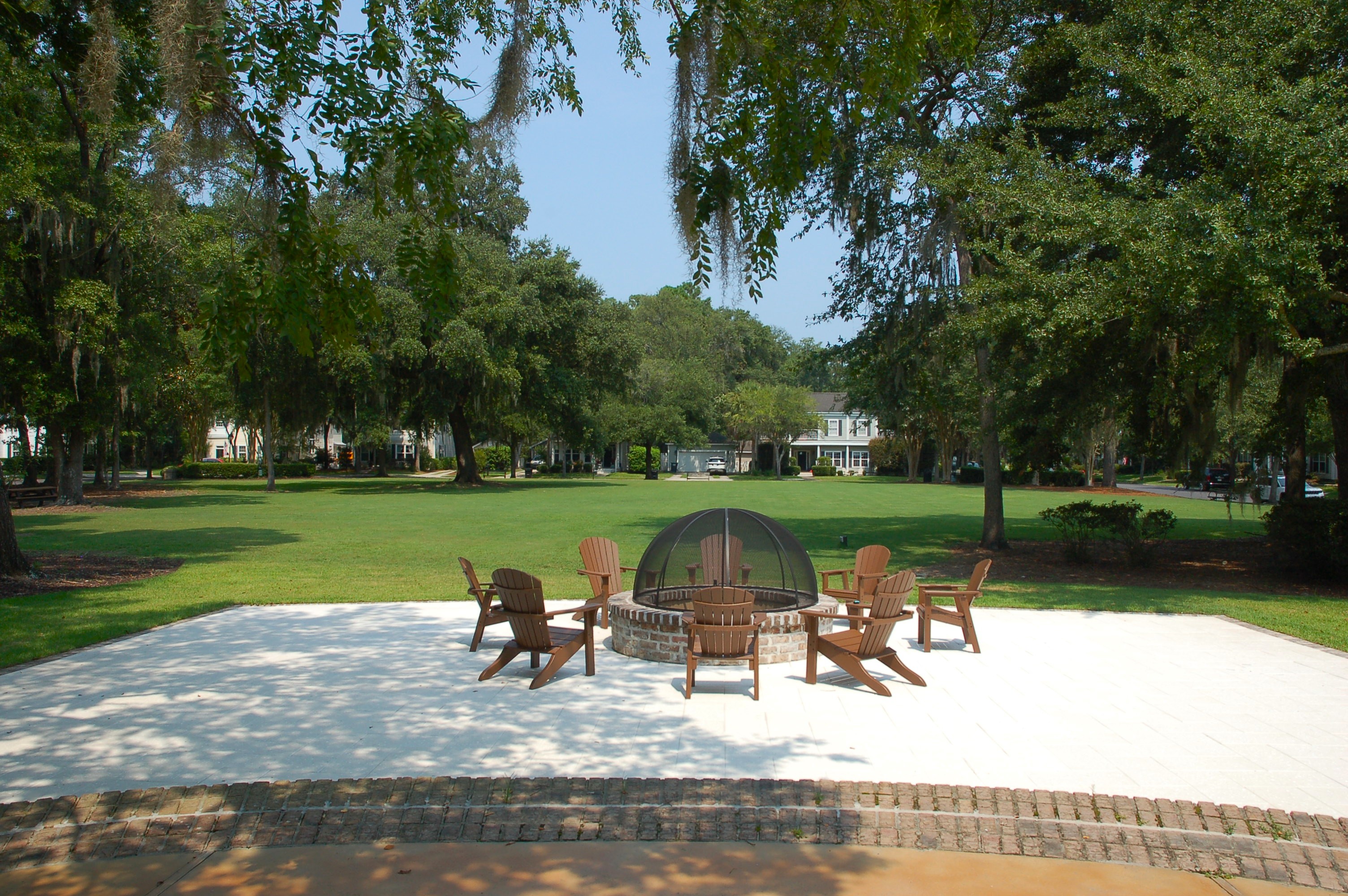 Community fire pit overlooking a green park area at Westbury Park in Bluffton, SC