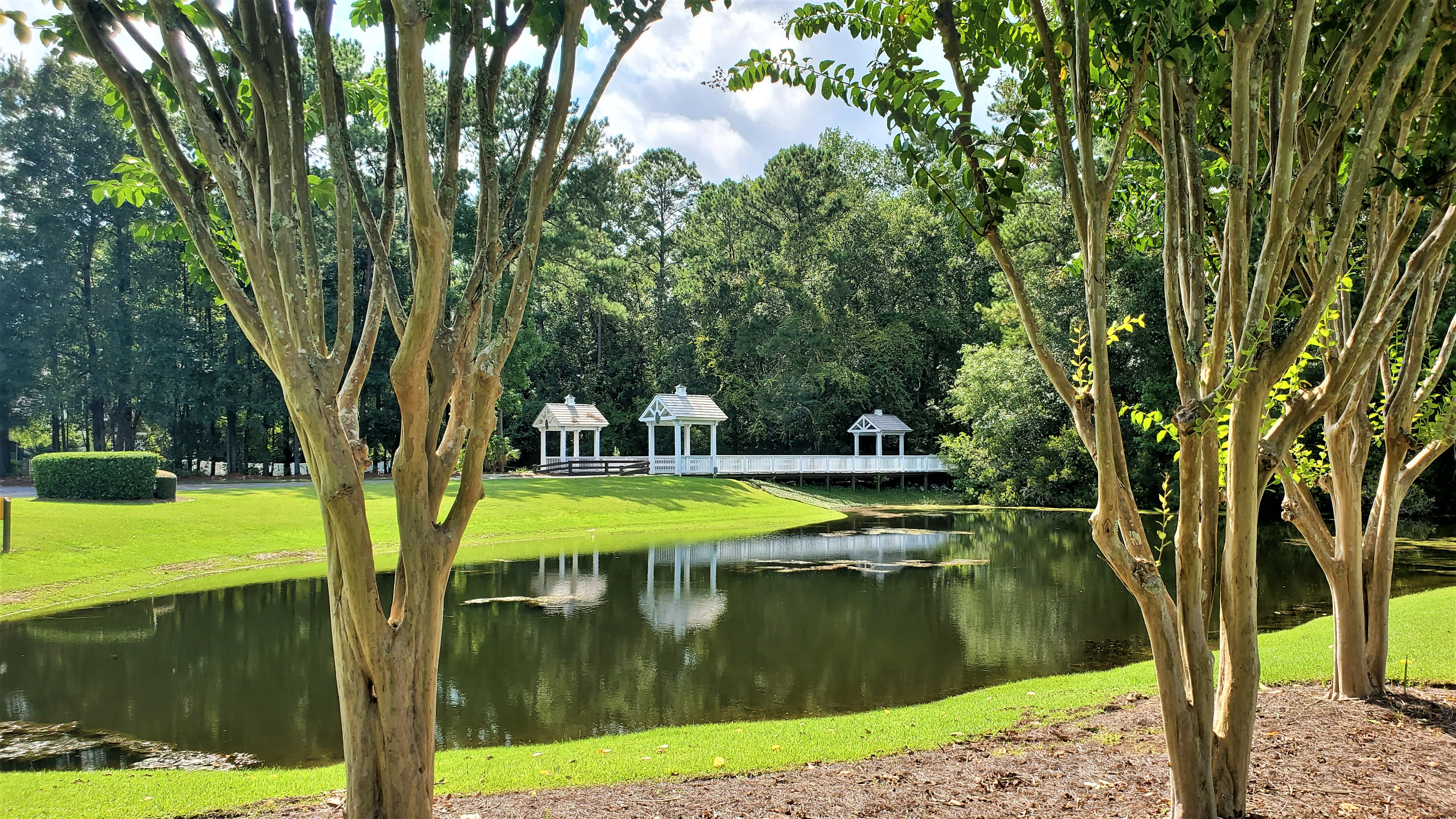The white wooden bridge over a lagoon that gives the Woodbridge community its name, Bluffton, SC