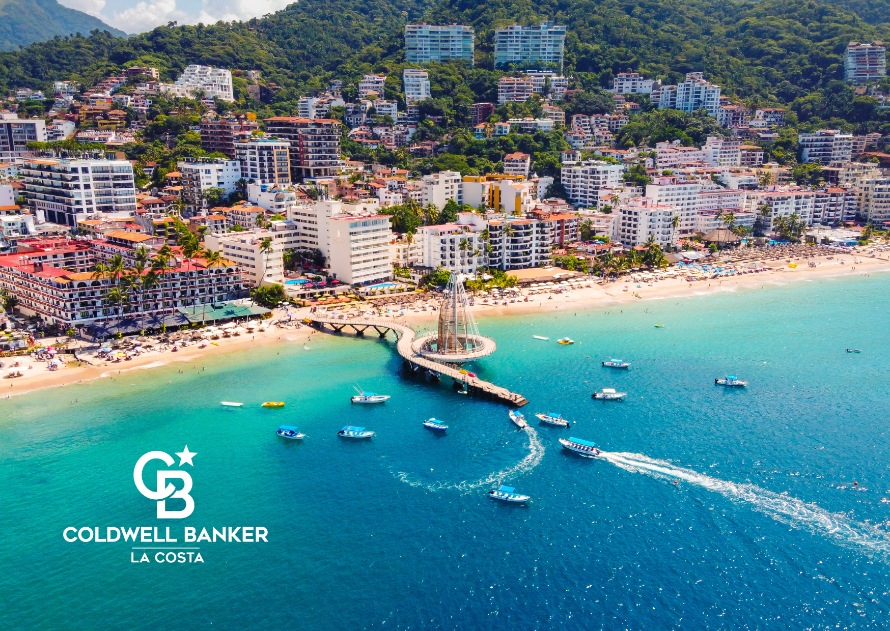 Luxury beachfront condos in Puerto Vallarta with Banderas Bay in the background, representing Coldwell Banker La Costa real estate expertise in 2025.
