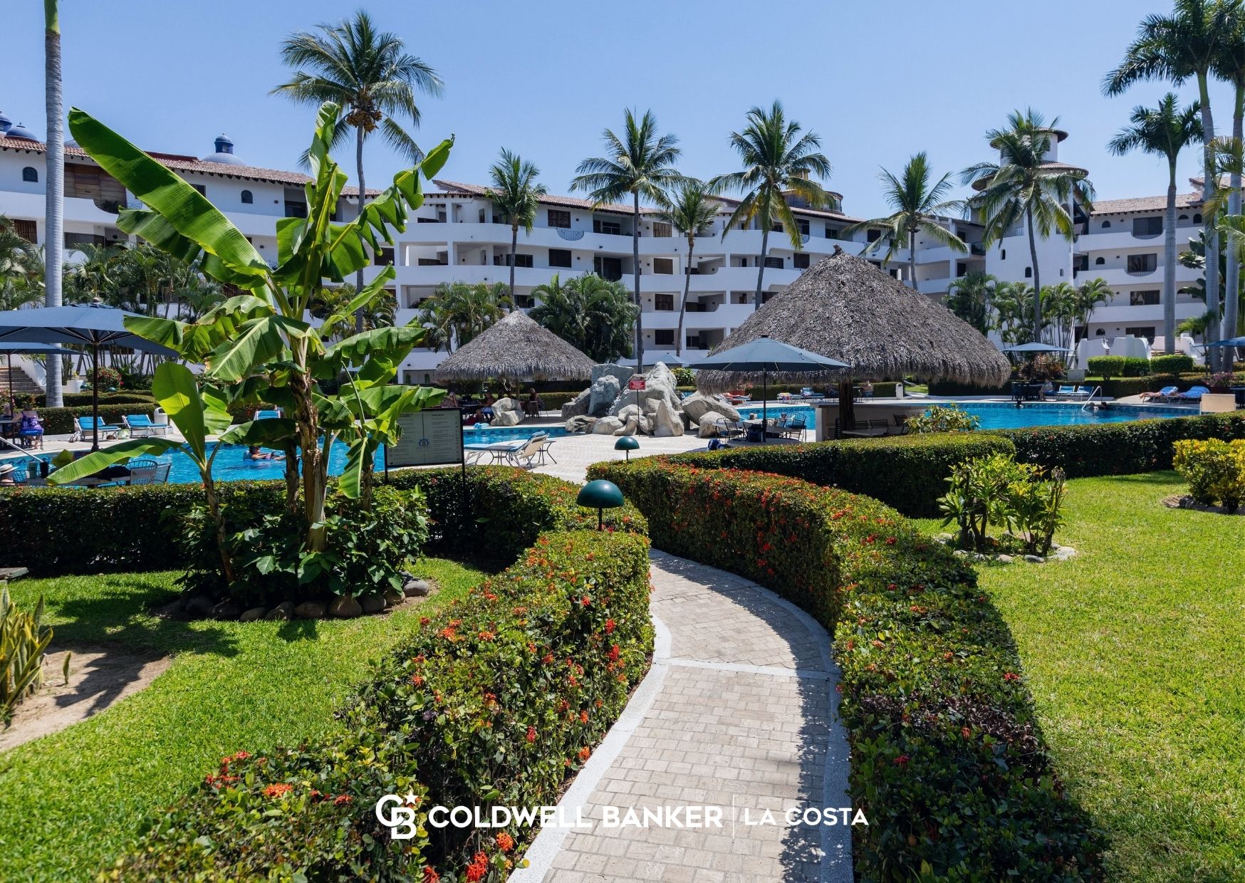 Condominium building with pool and amenities in Puerto Vallarta where owners pay monthly HOA maintenance fees