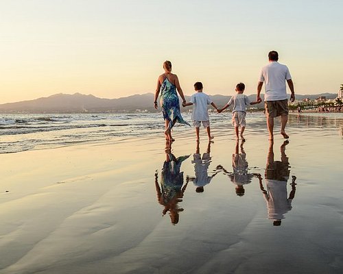 People enjoying the beach lifestyle in Puerto Vallarta at sunset