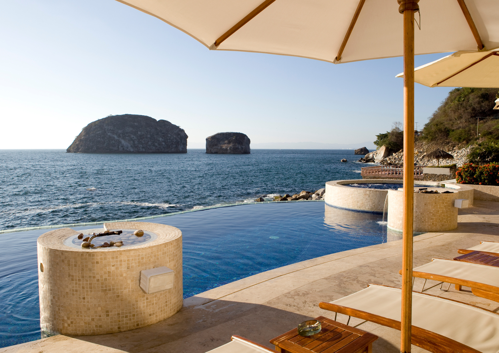Coldwell Banker La Costa agents Tom Gordon and Hannah Lopez advising clients on selling property in Puerto Vallarta