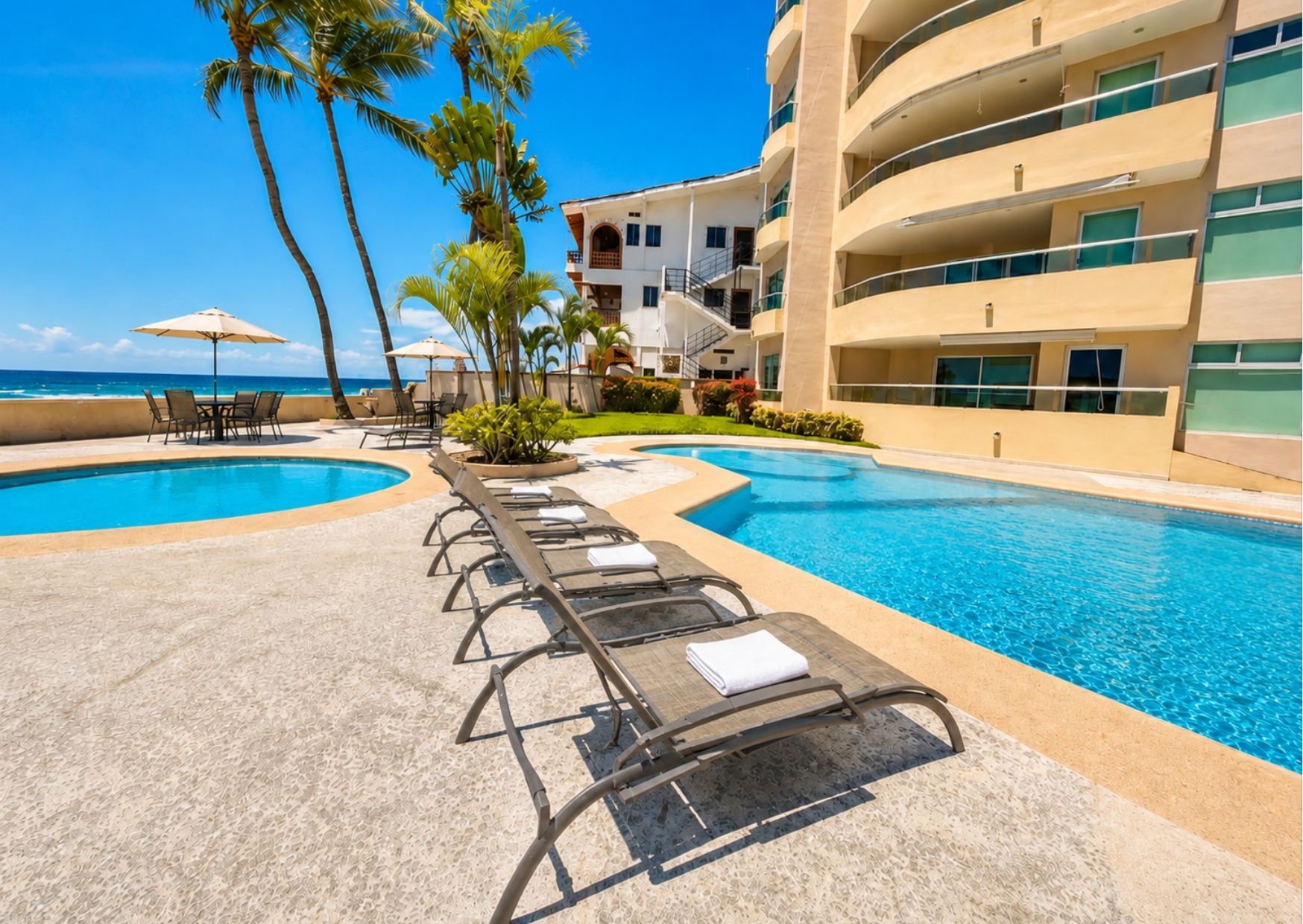 Oceanfront vacation rental condominium in Puerto Vallarta with a furnished terrace, illustrating short-term rental ROI for investors