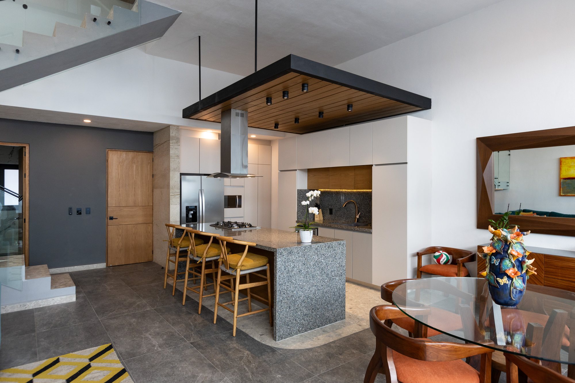 Kitchen island and breakfast bar seen from the dining table