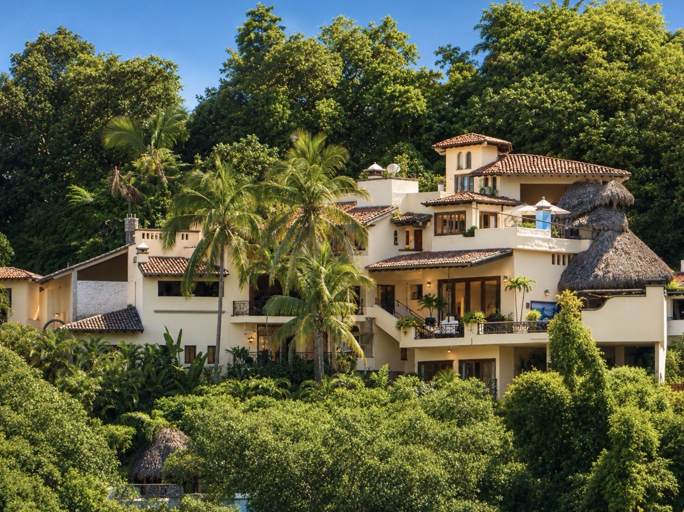 Casa Kalista's multi-level residence rising through tropical jungle in Lomas de Mismaloya
