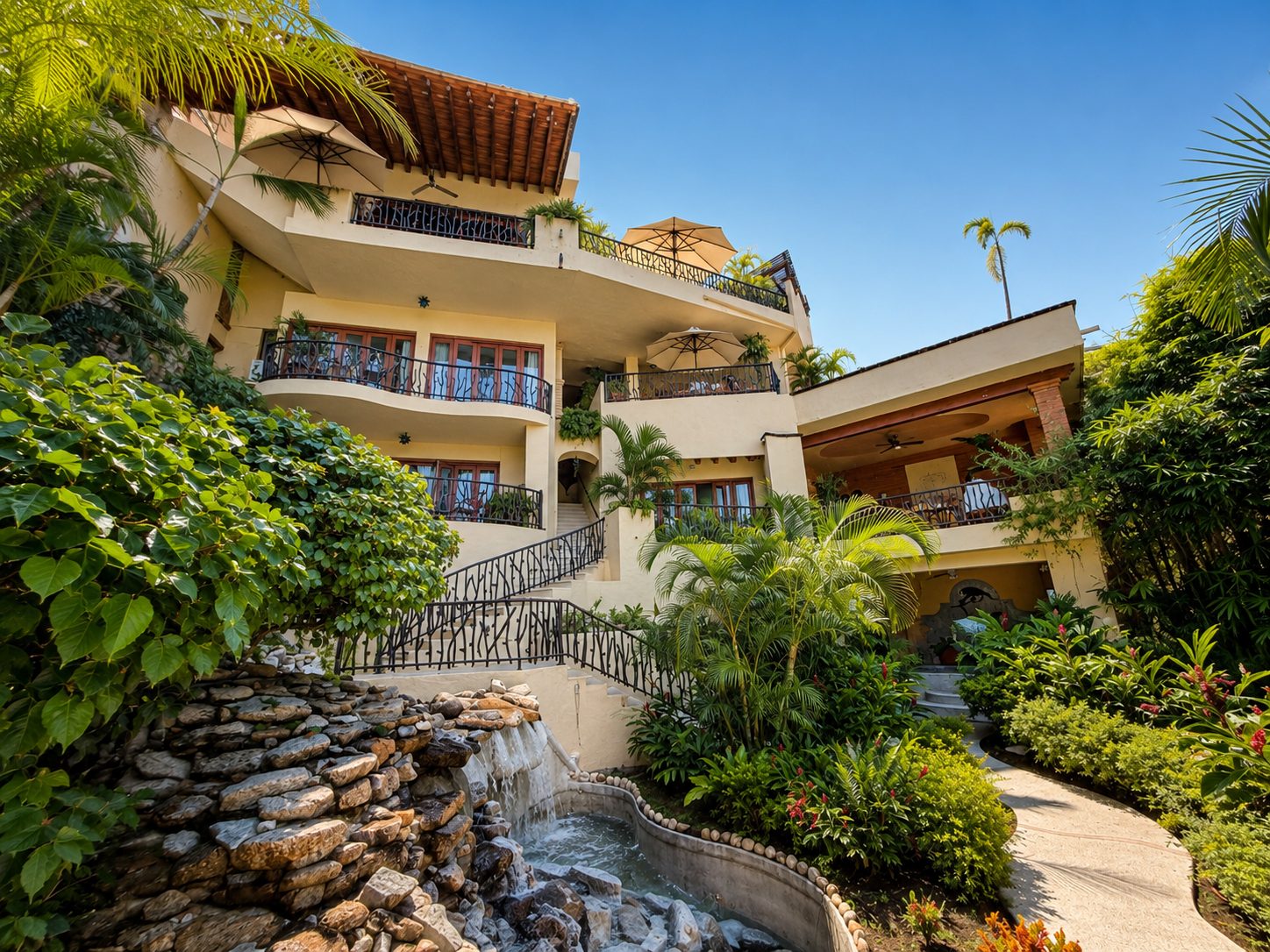 Garden path, waterfall and terraced facades at Casa Kalista