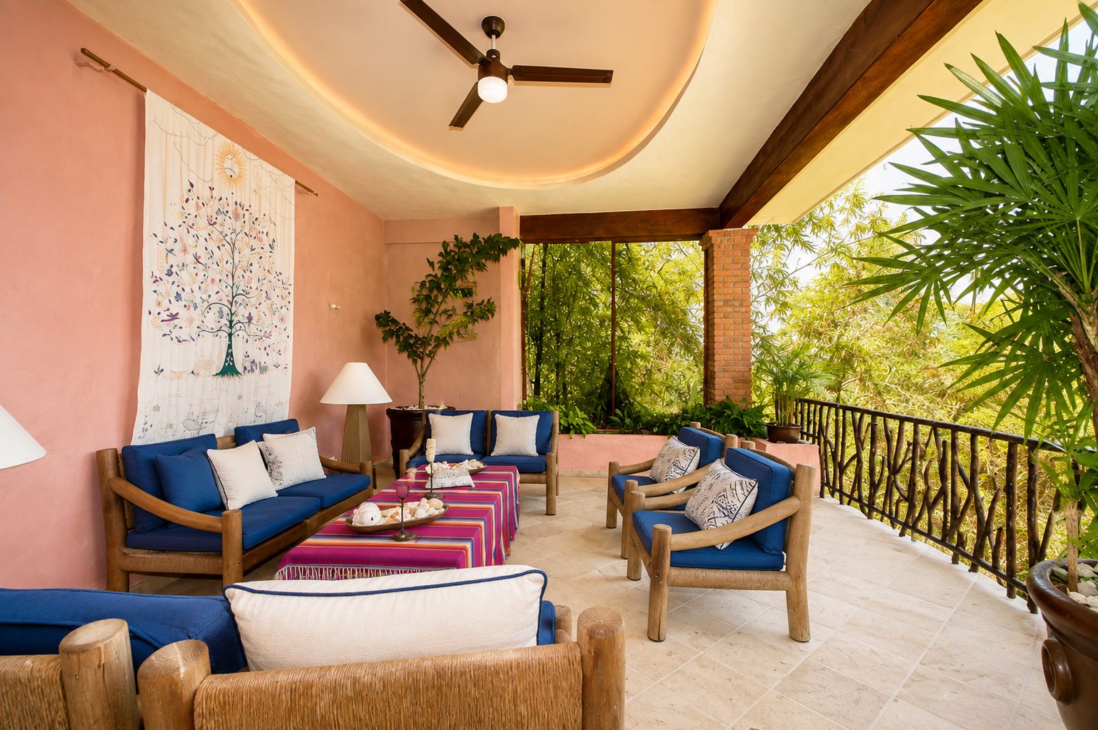 Open-air living room with ceiling fan and jungle views