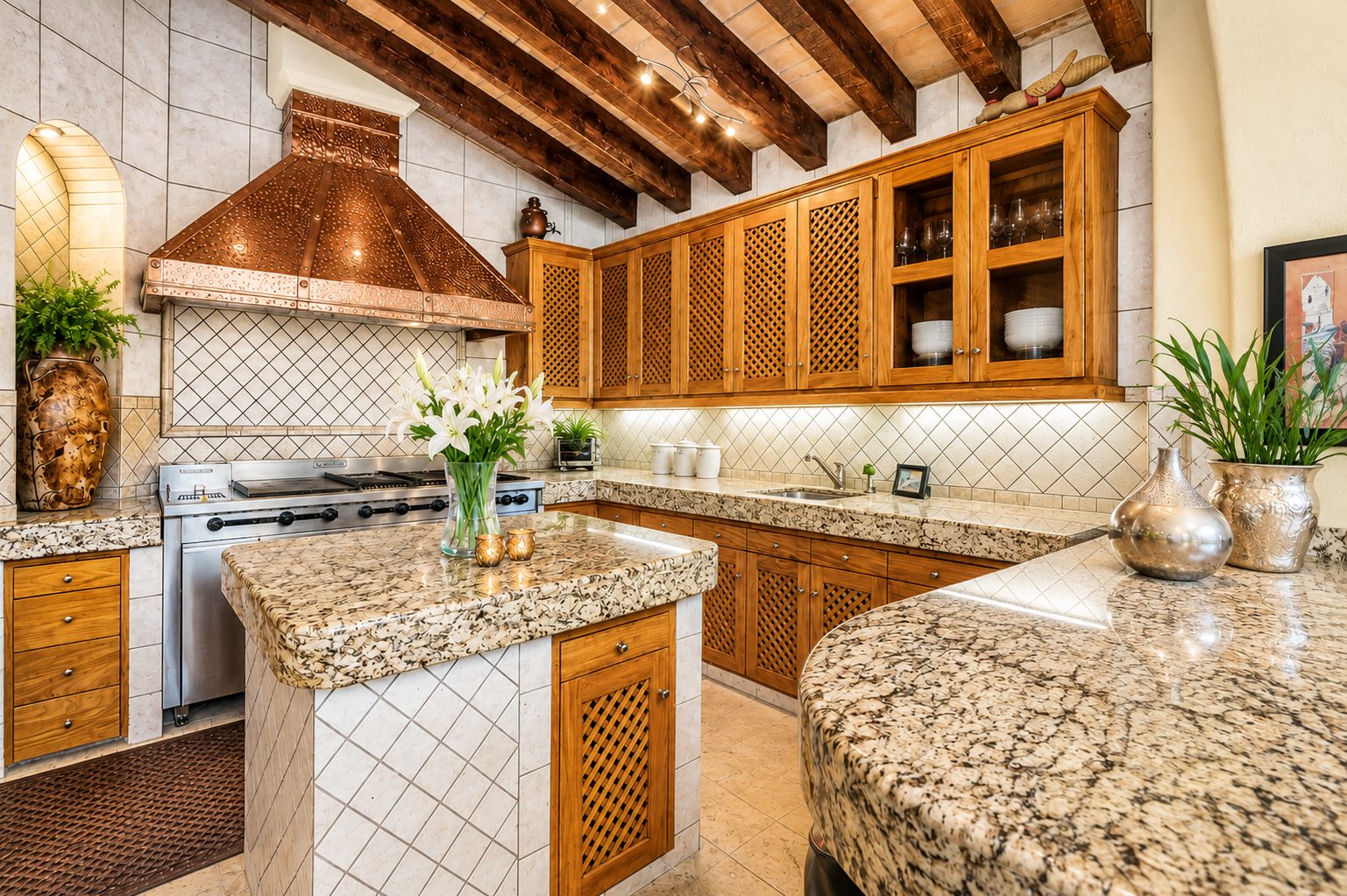 Kitchen with copper hood, granite island and wood cabinetry
