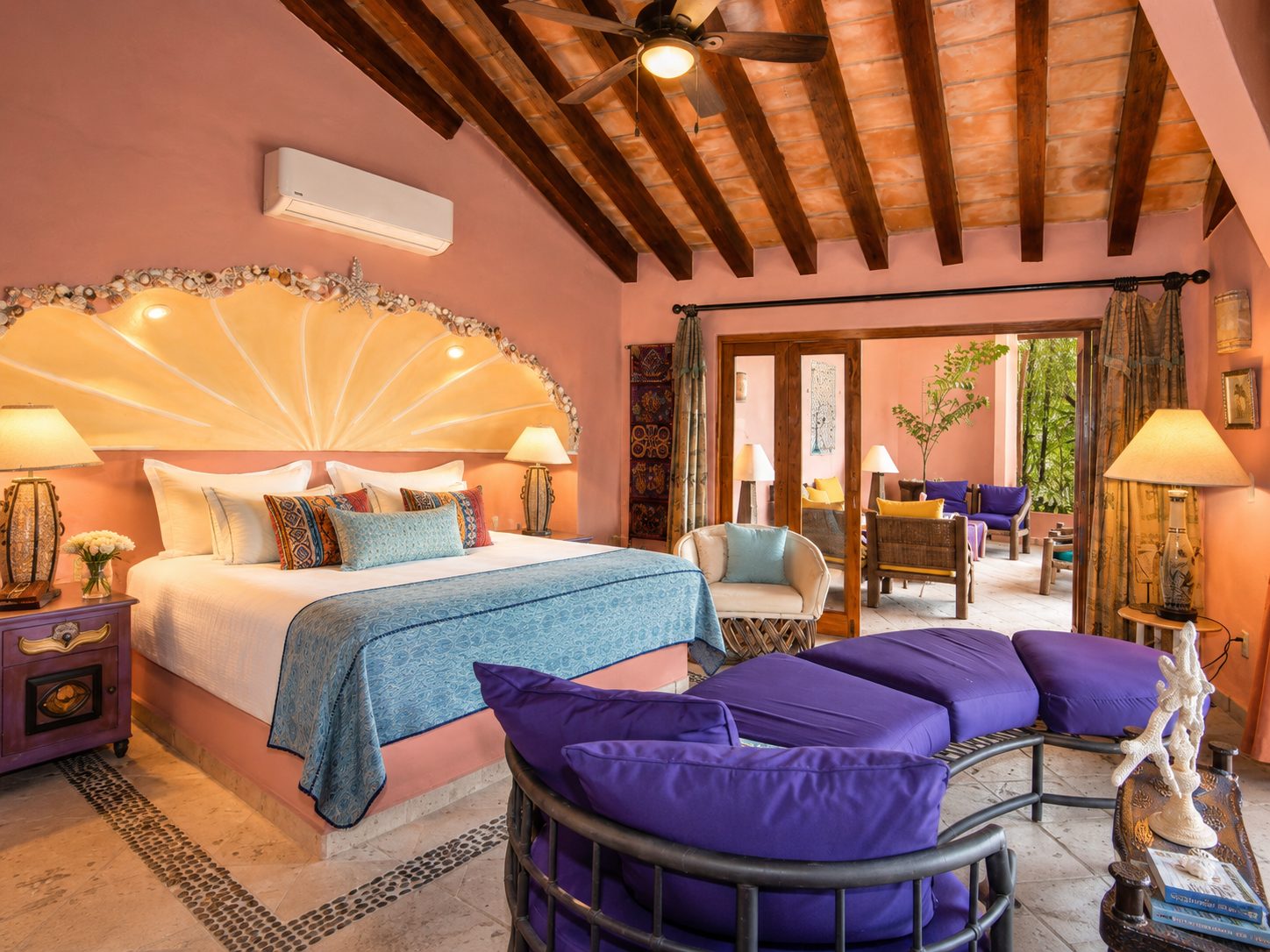 Bedroom suite with beamed ceiling, sitting area and terrace doors