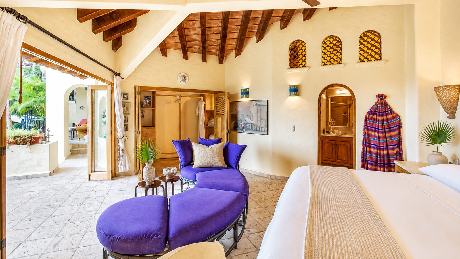 Bedroom suite with arched niches and sitting area