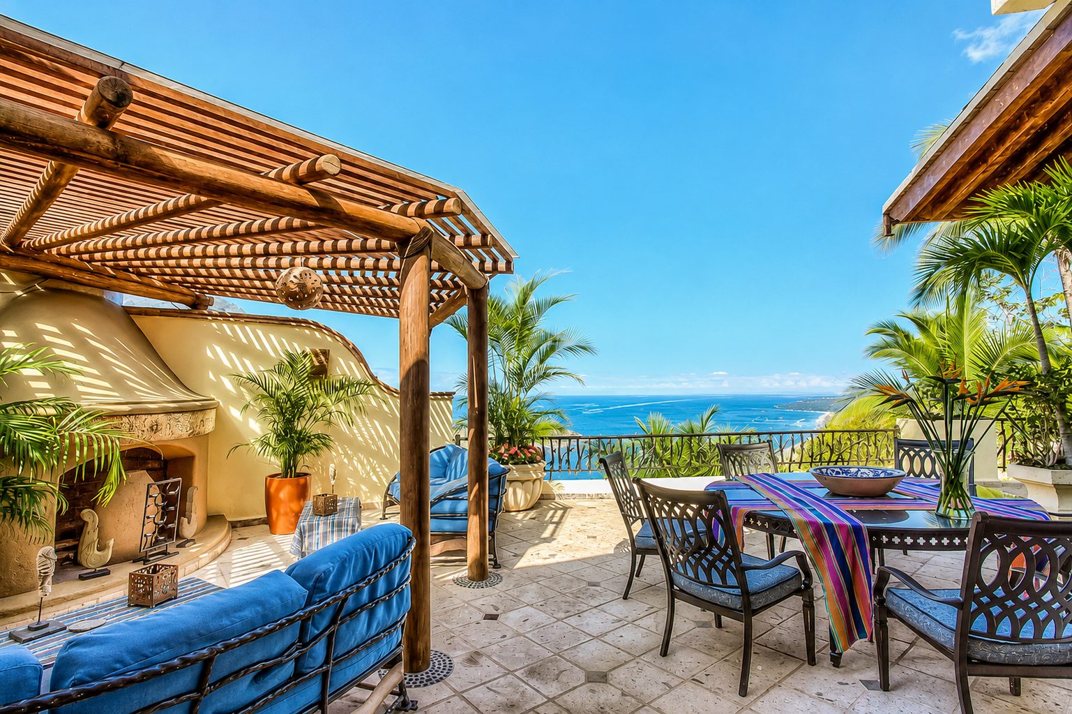 Rooftop pergola with fireplace lounge, dining and ocean view