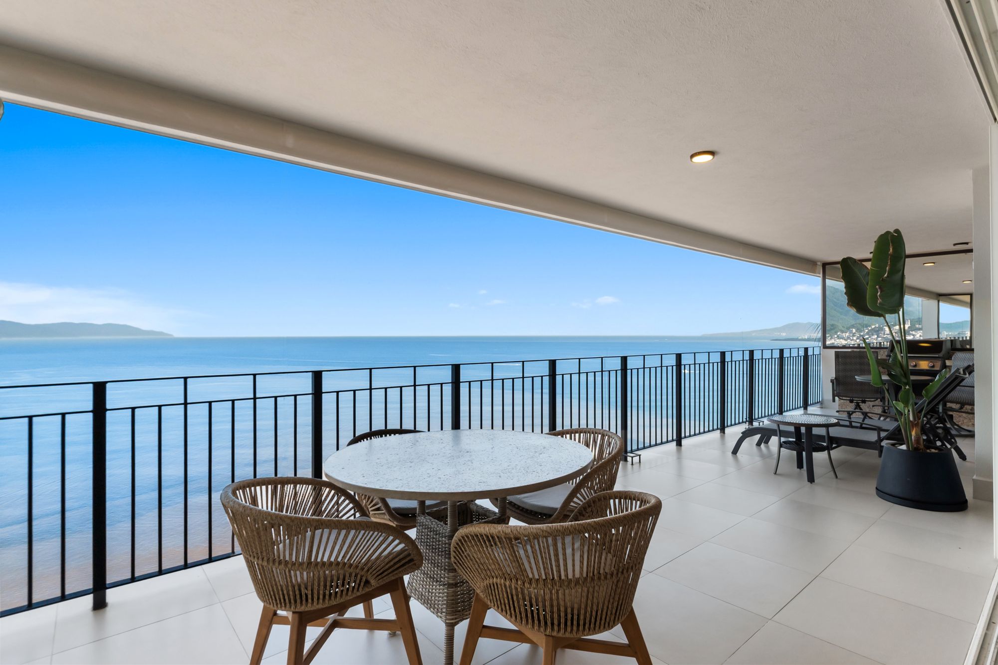 Terrace dining table on the 21st floor with an open view of Banderas Bay