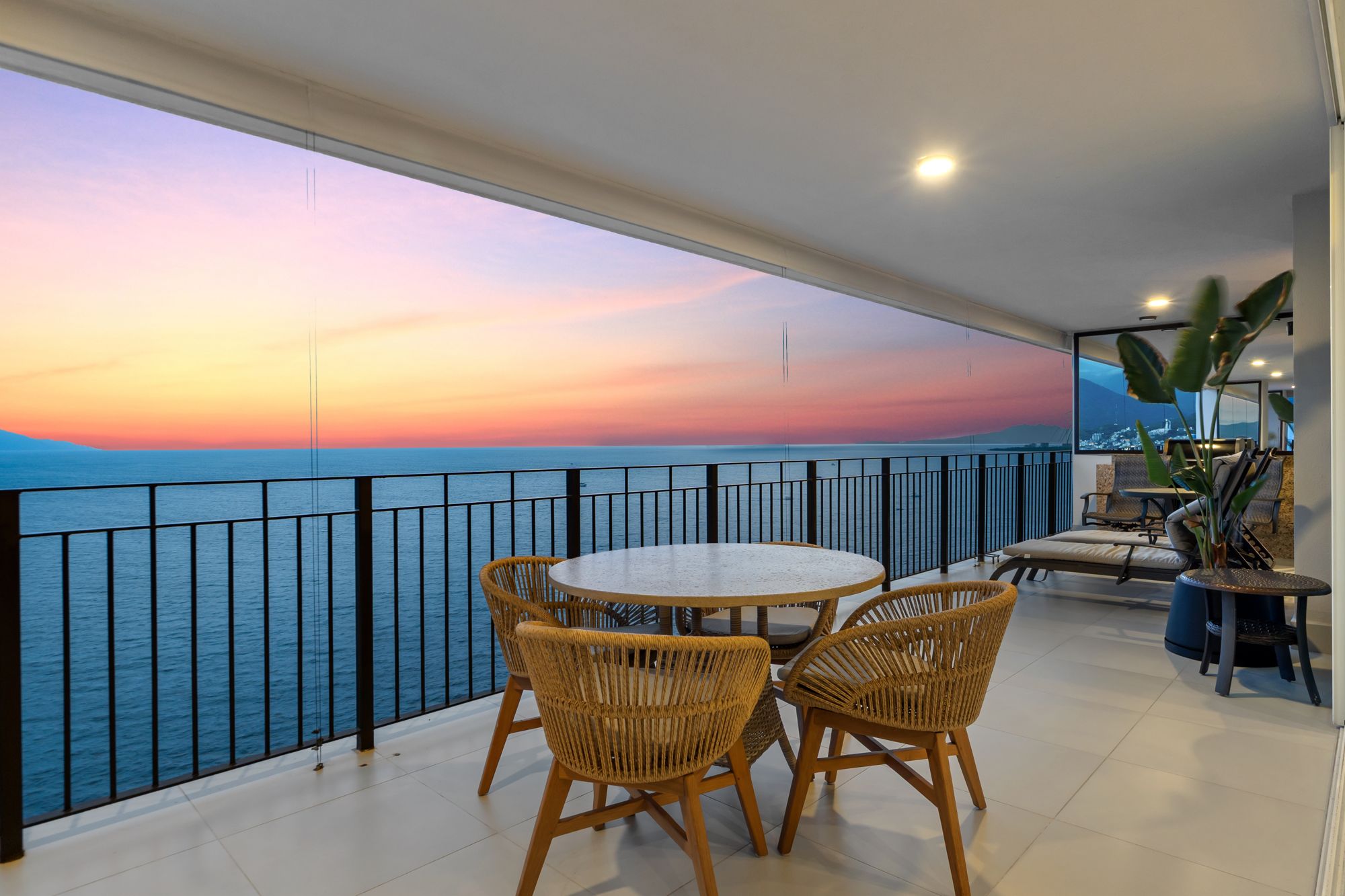 Terrace dining table at sunset over the Pacific