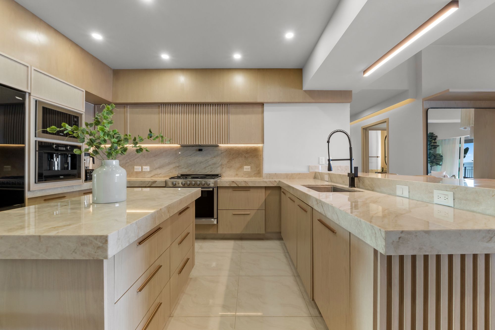 Oak cabinetry, quartzite counters and a professional-style range