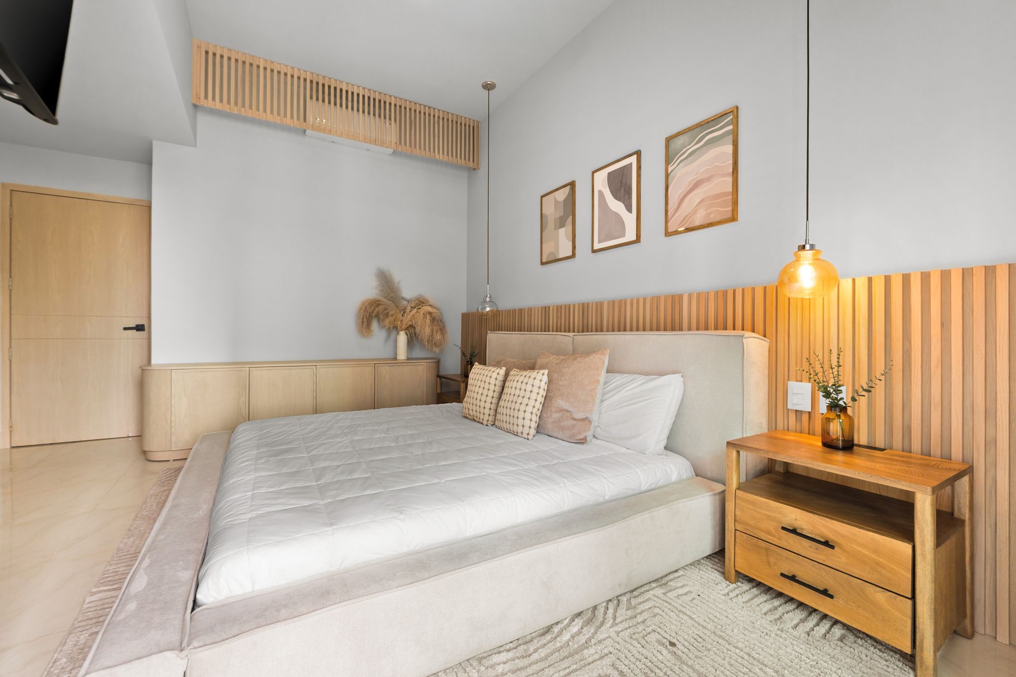 Fourth bedroom with an oak headboard wall