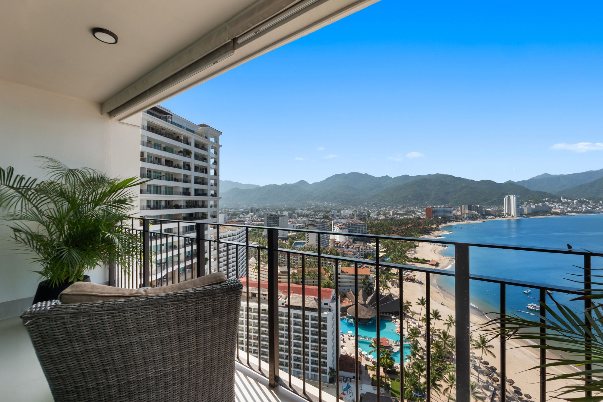 Balcony view of the city, the beach and the mountains