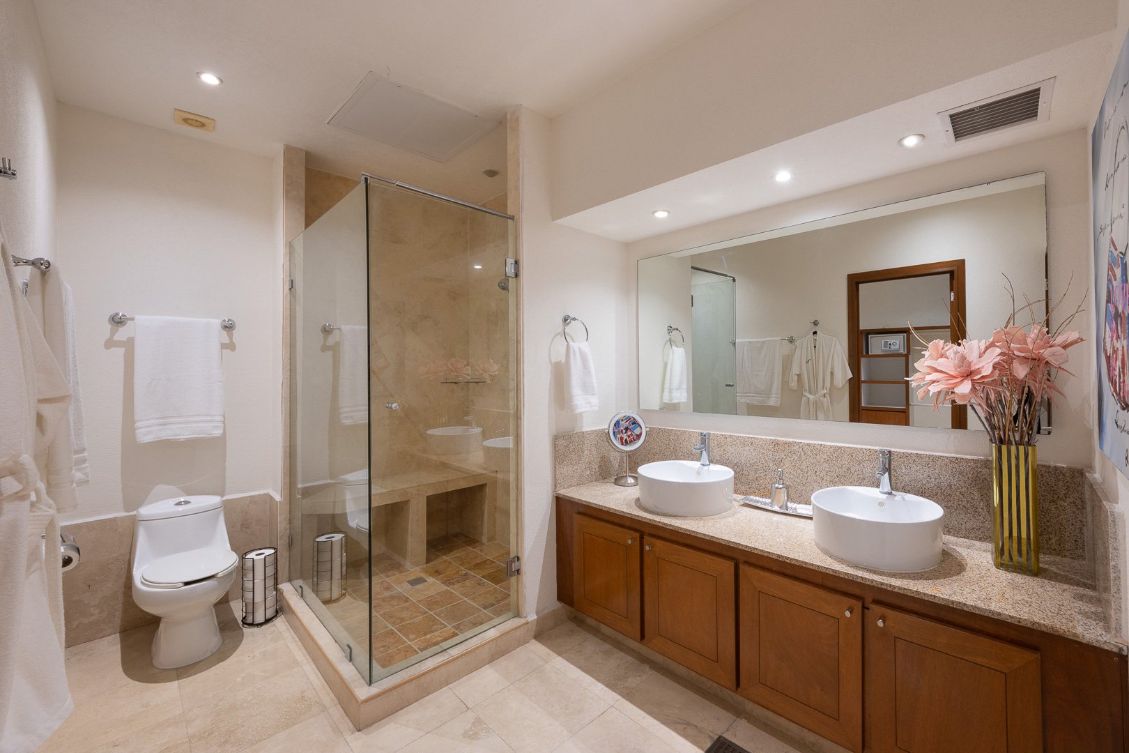 Bathroom with double sinks and glass shower