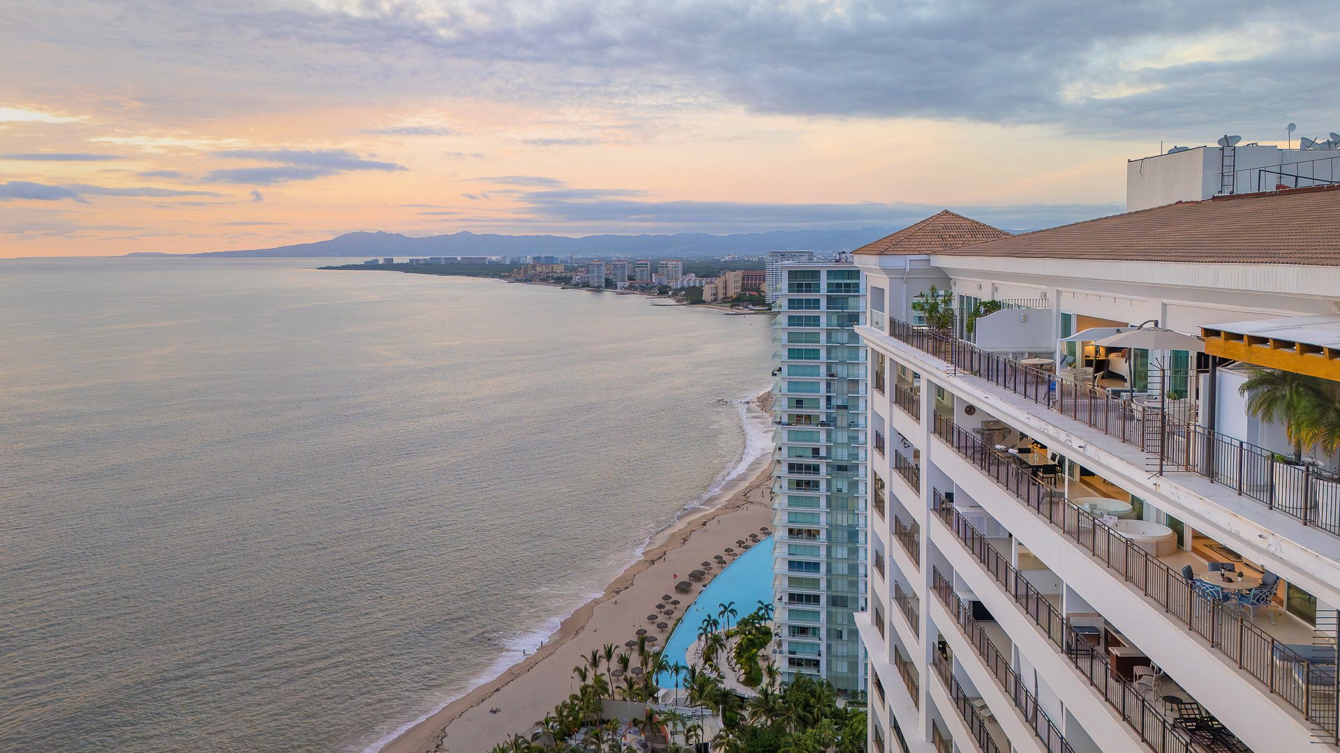 View from the penthouse along the beach toward Puerto Vallarta at dusk